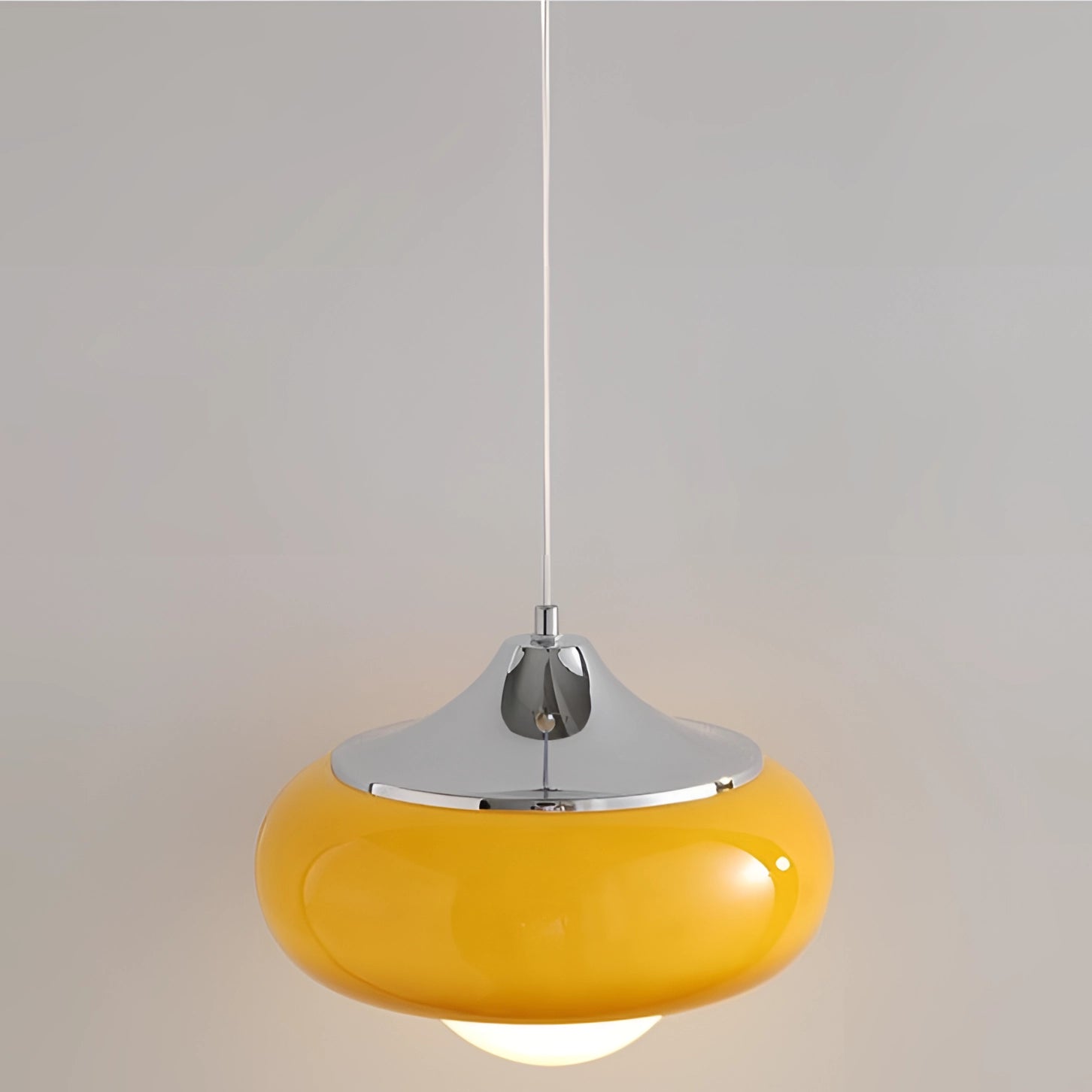 Modern dual color pendant lamps with a Scandinavian mid-century style, featuring a sleek oval and circular design, hanging from the ceiling.