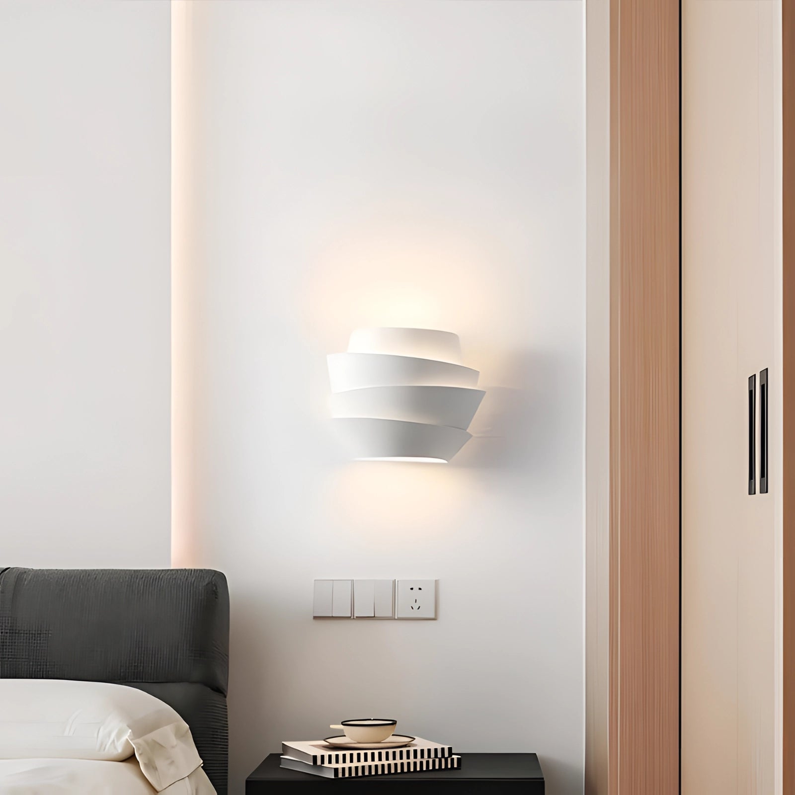Modern floating lamp with a minimalistic design featuring a soft glow light, set against a wooden backdrop. The lamp is rectangular in shape, blending seamlessly with the artistic and comfortable ambiance of the space, complemented by shelving and hardwood flooring.