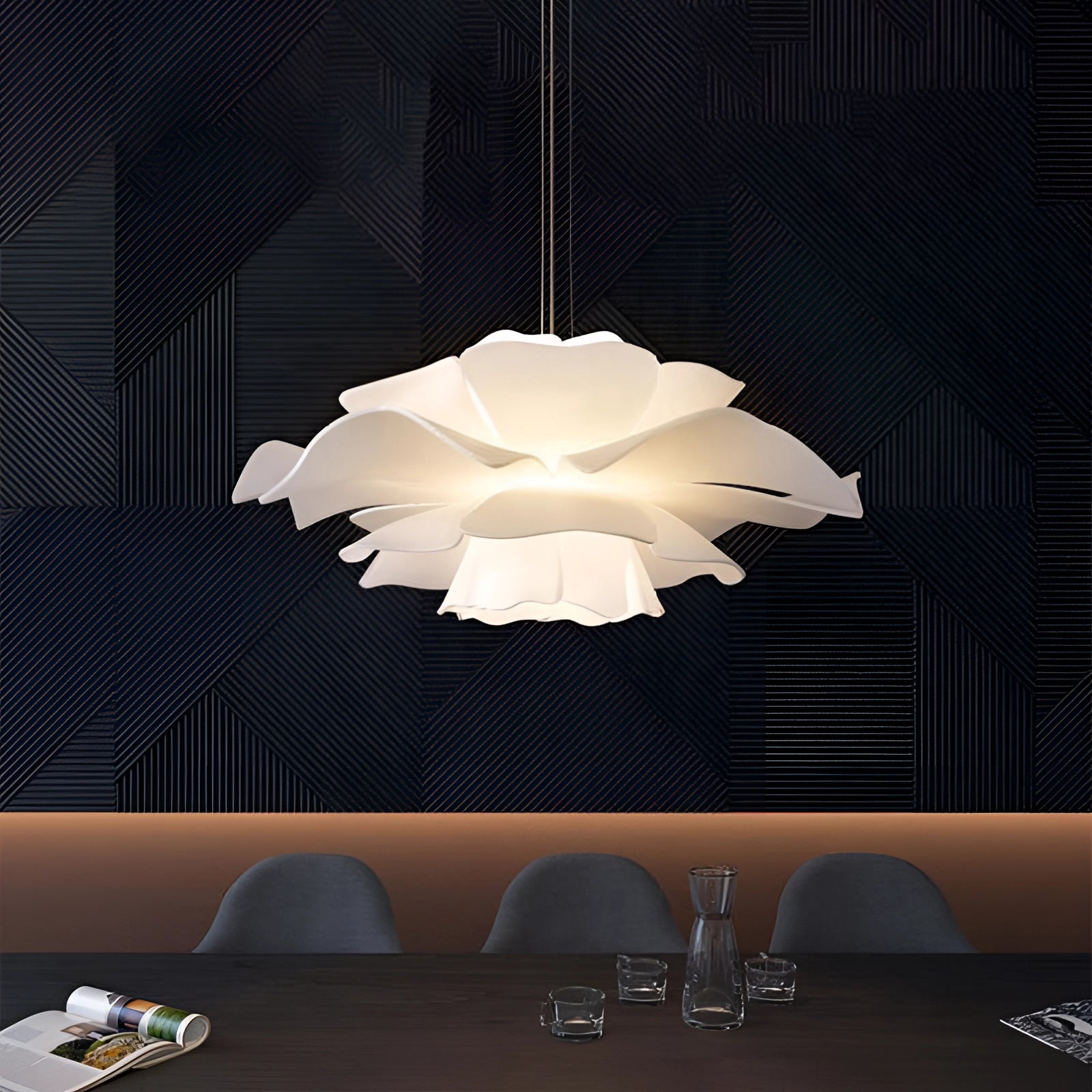 Modern flower-shaped pendant light in black with a floral chandelier design, showcasing intricate automotive and interior design elements, suitable for contemporary architecture and stylish décor.