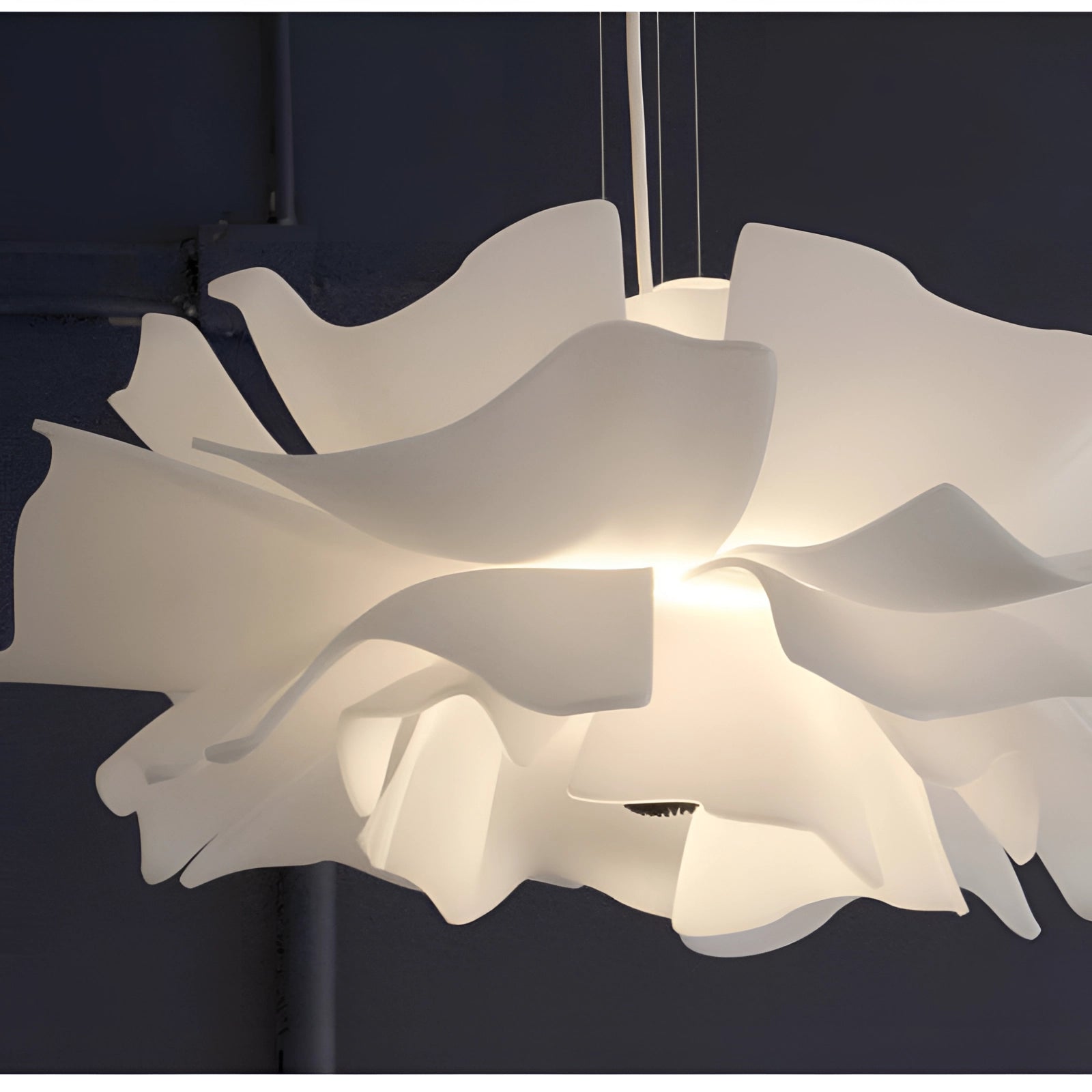 Modern flower-shaped pendant light with designer floral chandelier featuring intricate petal patterns and creative arts design, suitable for contemporary interiors.