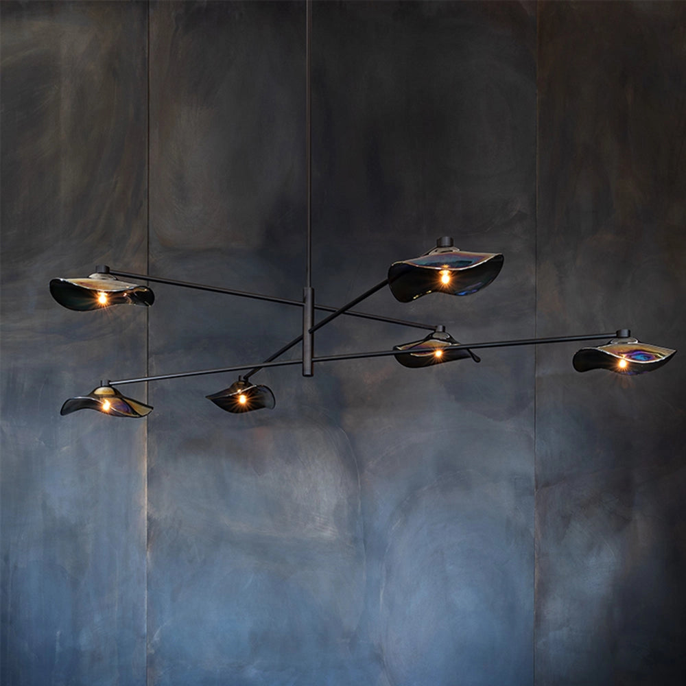 Modern geometric black and chrome multi-light chandelier with six multicolor heads, suspended from the ceiling.