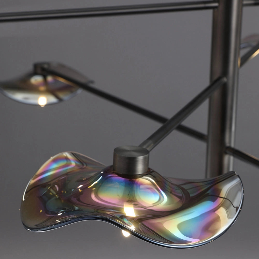 Modern geometric black and chrome multi-light chandelier with circular design hanging from the ceiling, featuring sleek and stylish visual effect lighting.