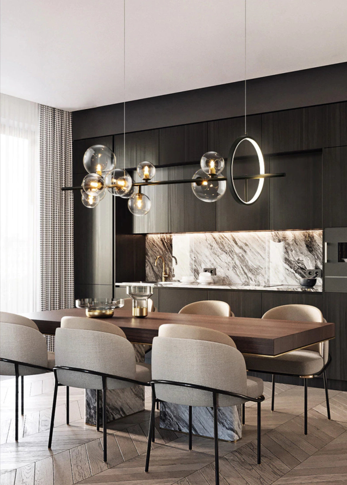 Modern geometric brass and glass chandelier hanging in a stylish living room with wooden furniture and beige decor.
