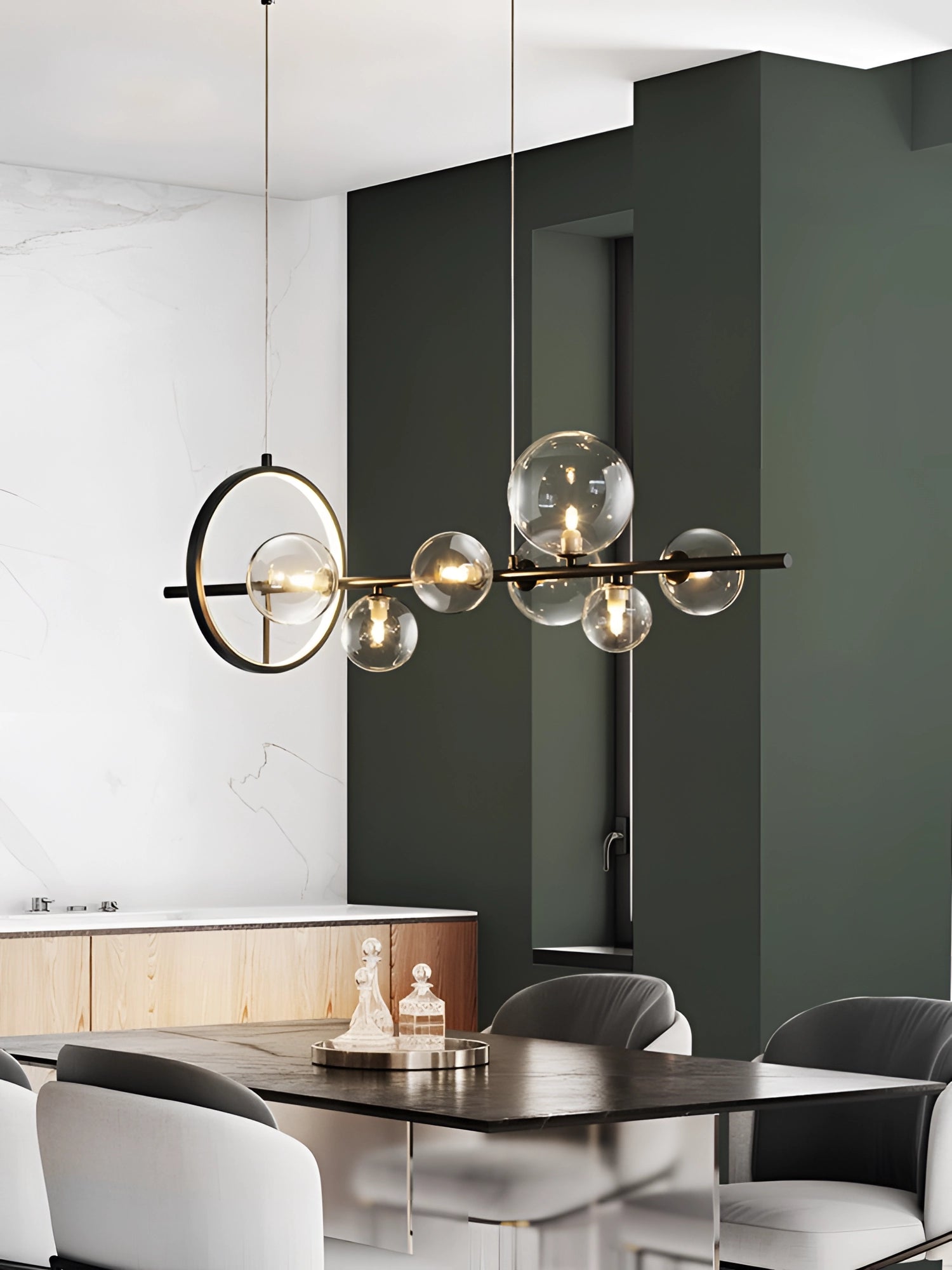 Modern geometric brass and glass chandelier hanging from ceiling, illuminating a stylish interior with wooden floors and contemporary decor.