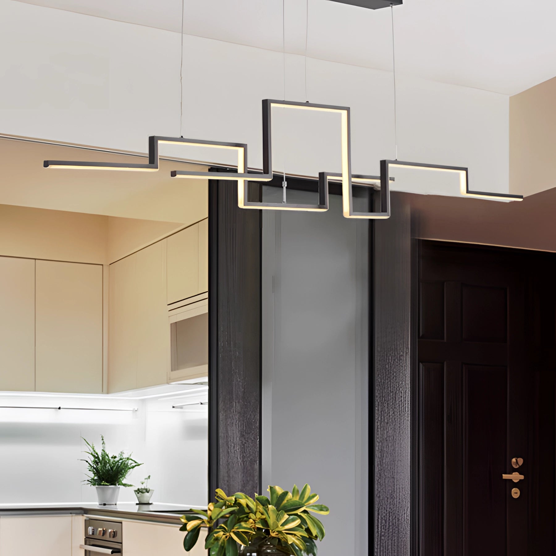 Modern geometric chandelier with luxury LED pendant light, shown in an interior setting with dimmable feature; surrounded by contemporary decor elements like houseplants and wooden accents.