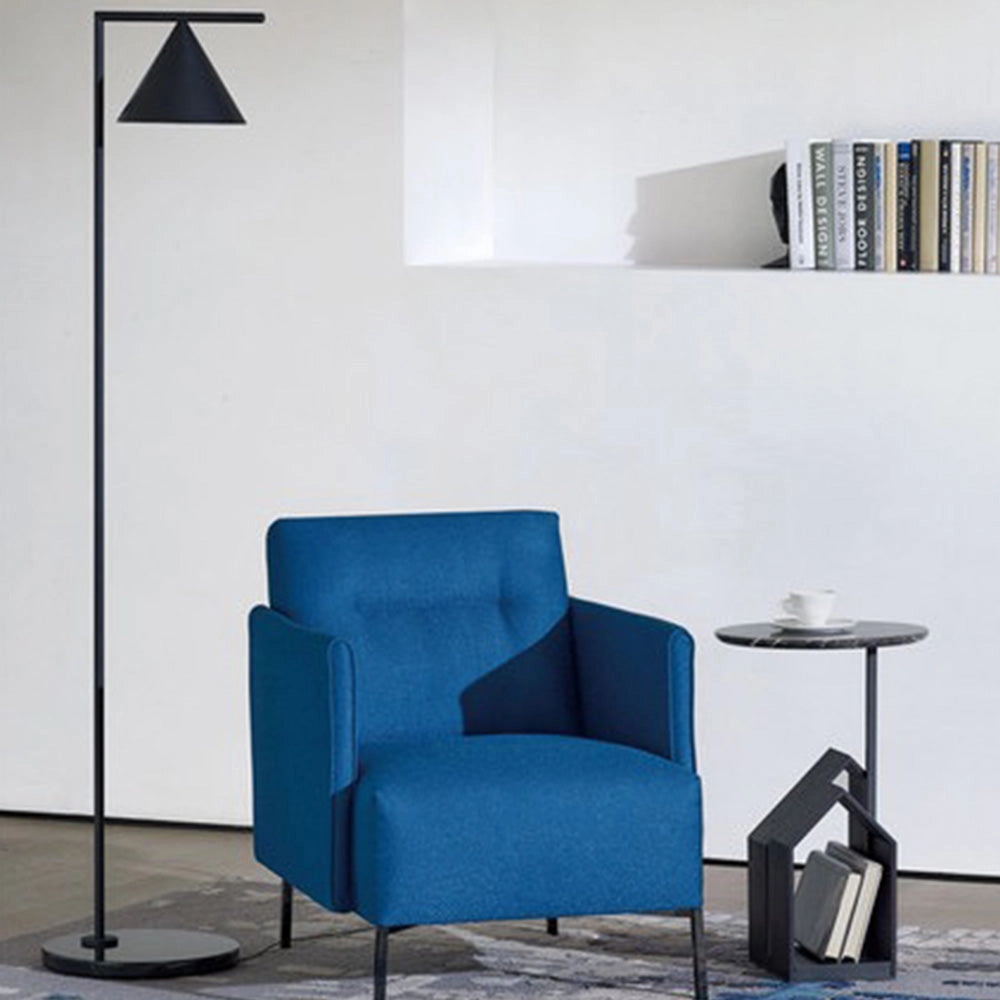 Modern geometric gold floor lamp with a minimalist design, featuring a black base and a cold white light, set against a grey and azure backdrop, highlighting its sleek lines and contemporary feel.