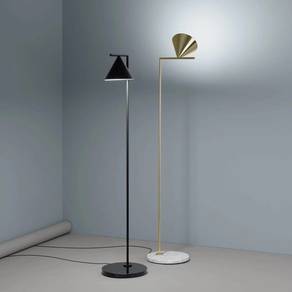 Modern geometric gold floor lamp with a minimalist design, featuring a rectangular shape and cold white lighting, placed on a wooden floor, resembling an artistic sculpture with symmetrical elements.