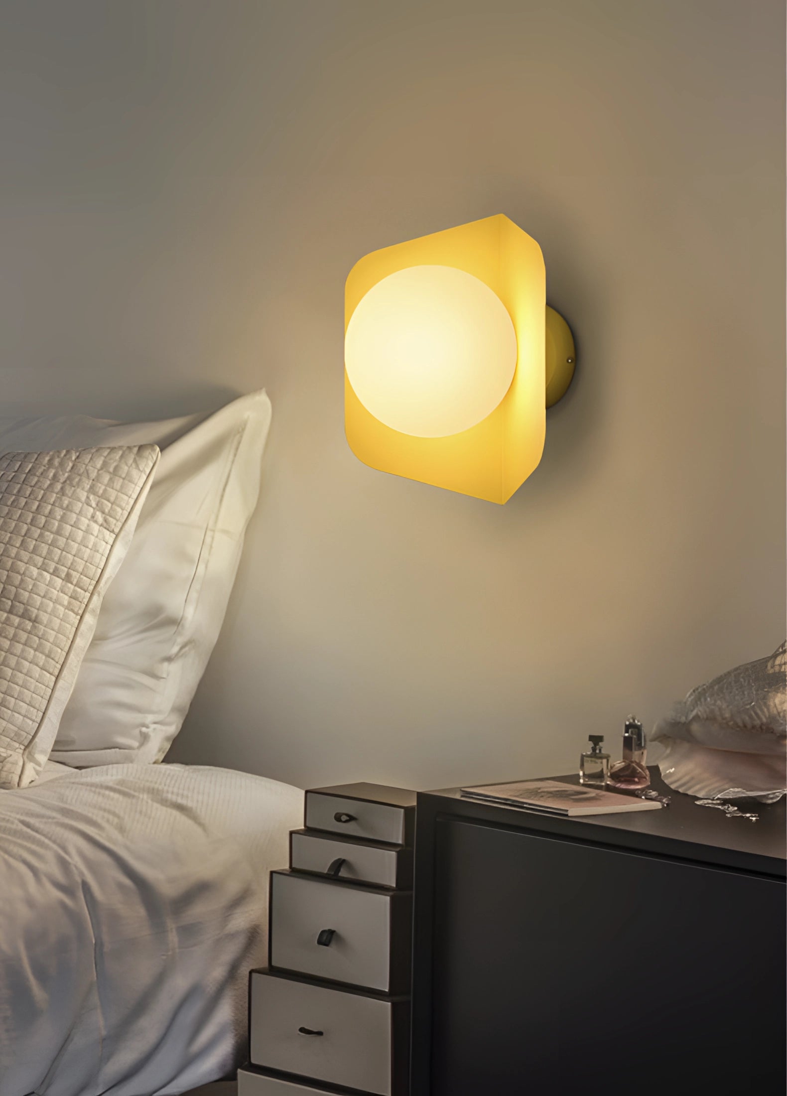Modern geometric LED wall lamps with multi-color hexagonal fixtures mounted on a wall in a contemporary interior design setting.