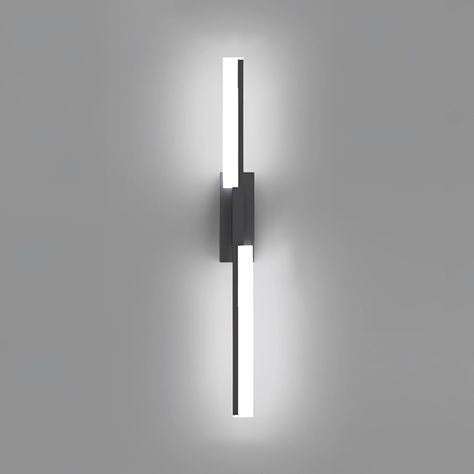 Modern geometric LED wall sconce in black, featuring a minimalist design with a rectangular shape and symmetrical elements, illuminated with white light.