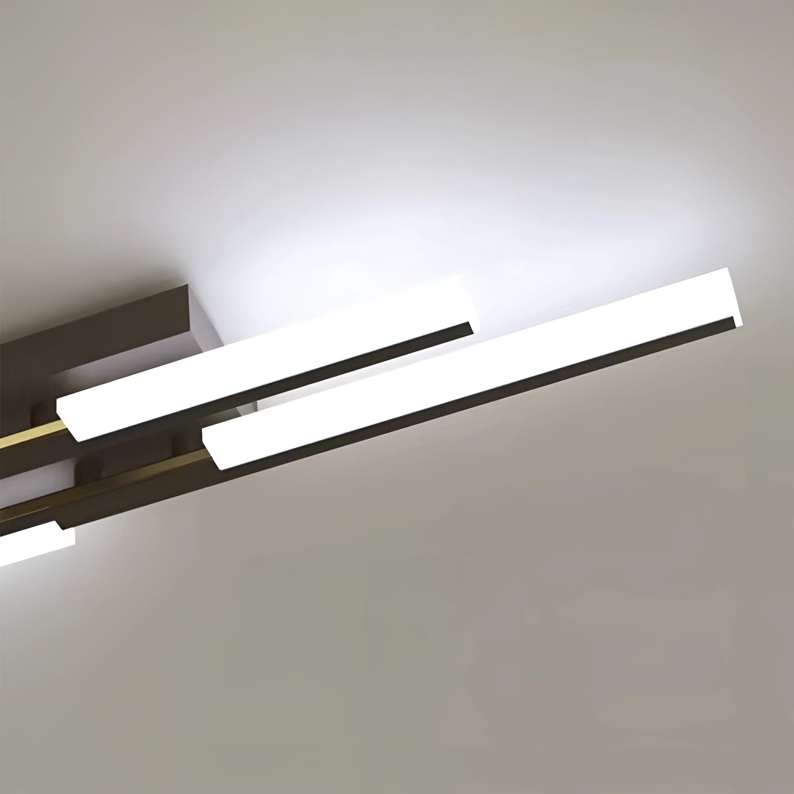 Modern geometric LED wall sconce with a minimalist black and white design, featuring a rectangular shape and a sleek metal finish, ideal for contemporary interiors.