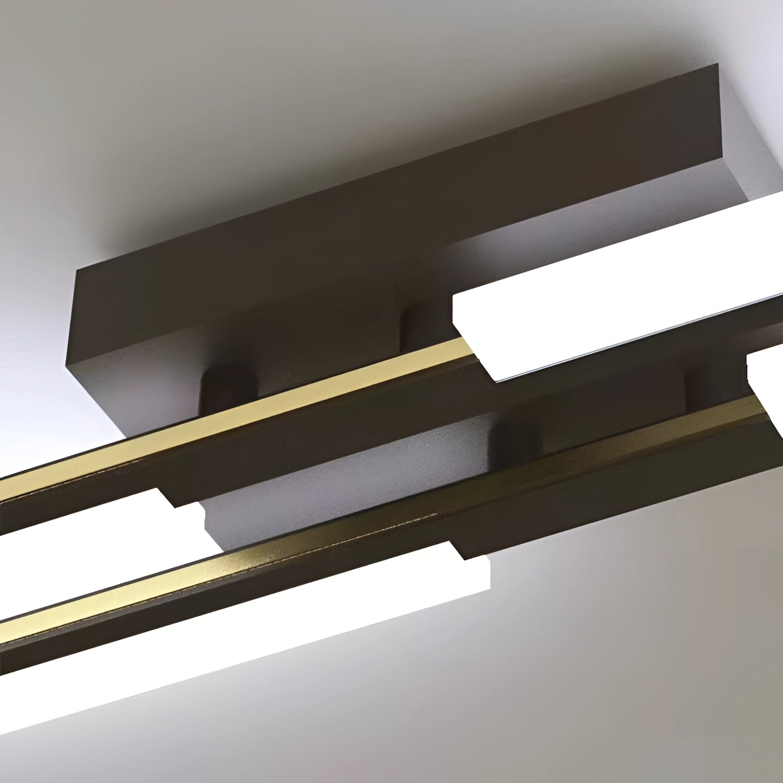 Modern geometric LED wall sconce featuring a minimalist black and white rectangular design, crafted from composite materials and metal, suitable for indoor lighting as a ceiling fixture or wall accent.
