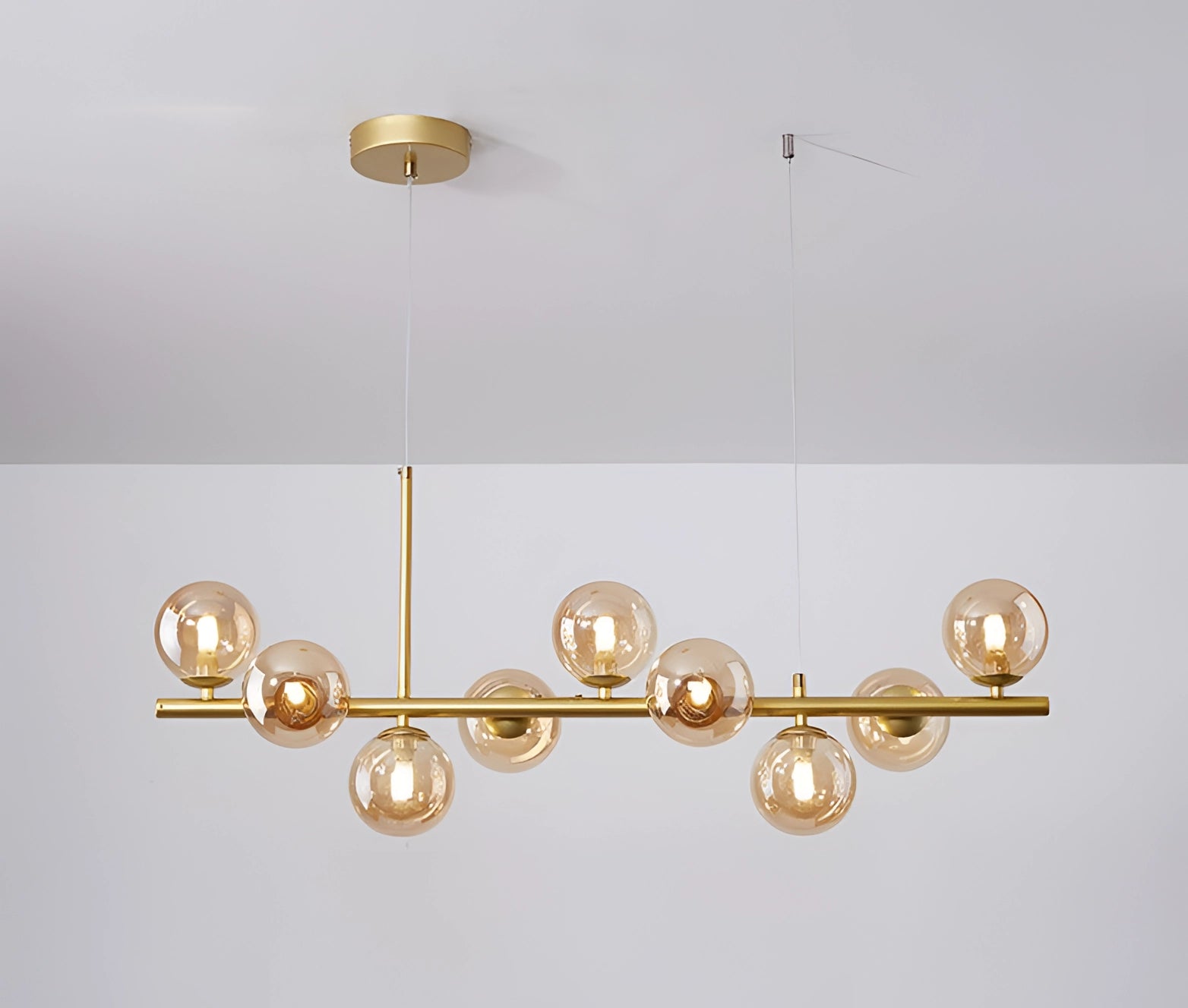 Modern Glass Globe Chandelier with Adjustable Bronze Pendant, Gold-Cognac finish, featuring a circular design and wooden accent.