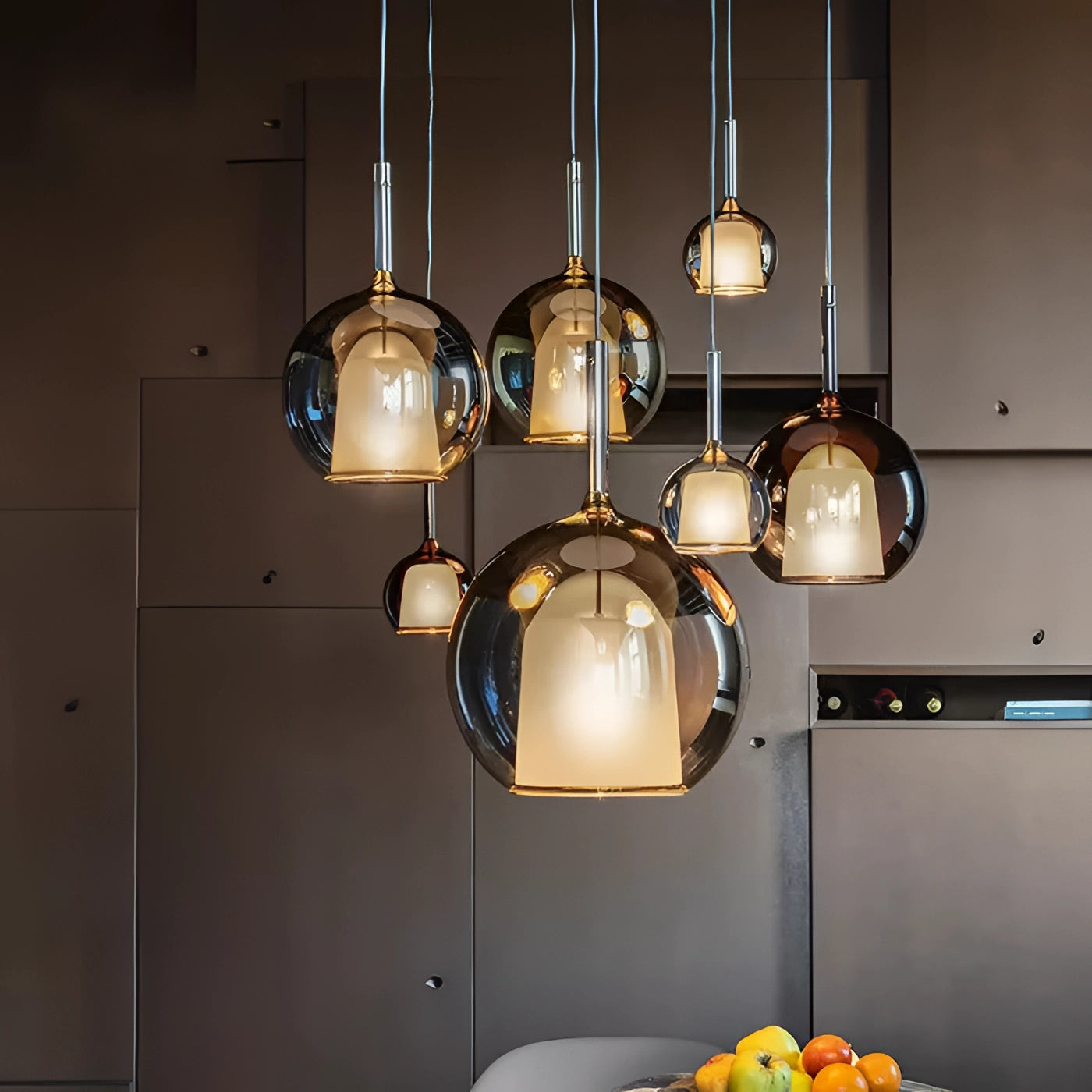 
Gold-finished modern glass globe pendant light with smoked glass shade, 25cm in diameter, designed for kitchen interiors.