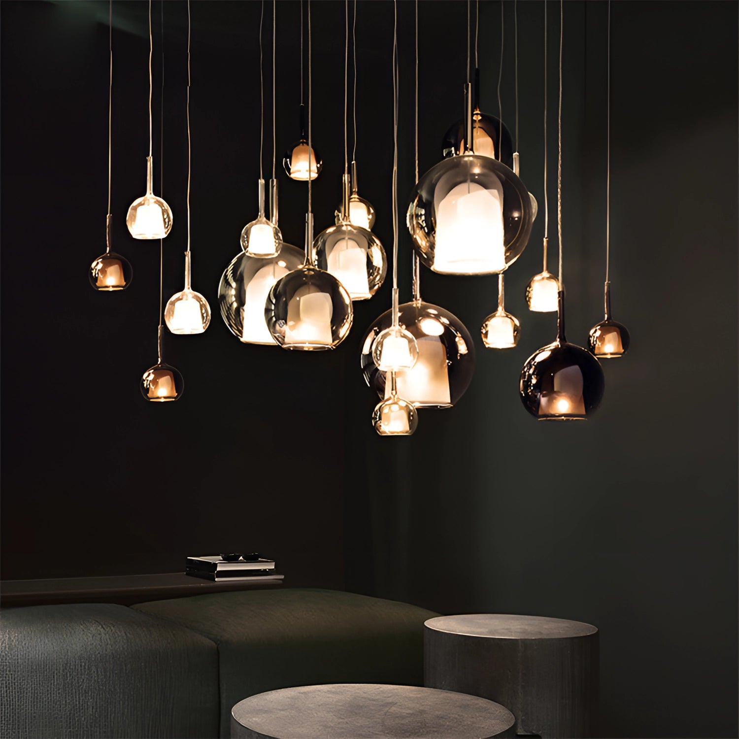 Modern glass globe pendant light with a smoked chocolate finish, featuring a 25cm diameter. It is suspended from the ceiling and includes a light bulb, casting a warm, ambient glow.