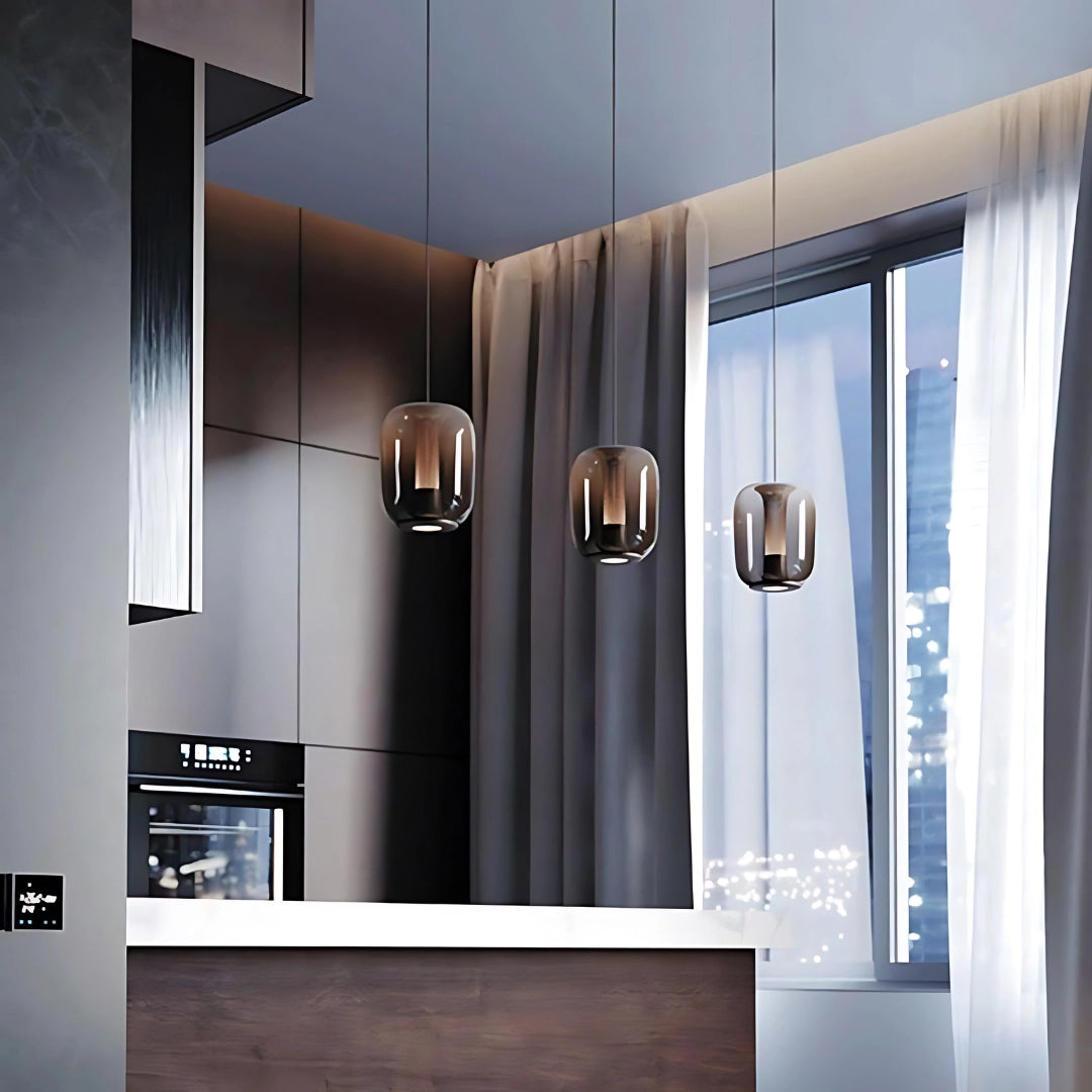 Modern glass LED pendant light with a sleek, minimalist design, hanging in a stylish bedroom setting, showcasing elements of interior design with wooden flooring and large windows.