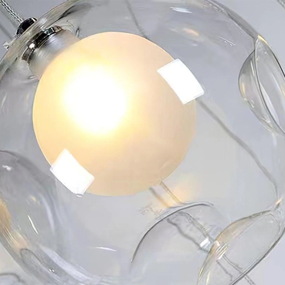 Modern globe pendant chandelier with adjustable LED lights, featuring a sleek circular metal design, suspended from the ceiling.