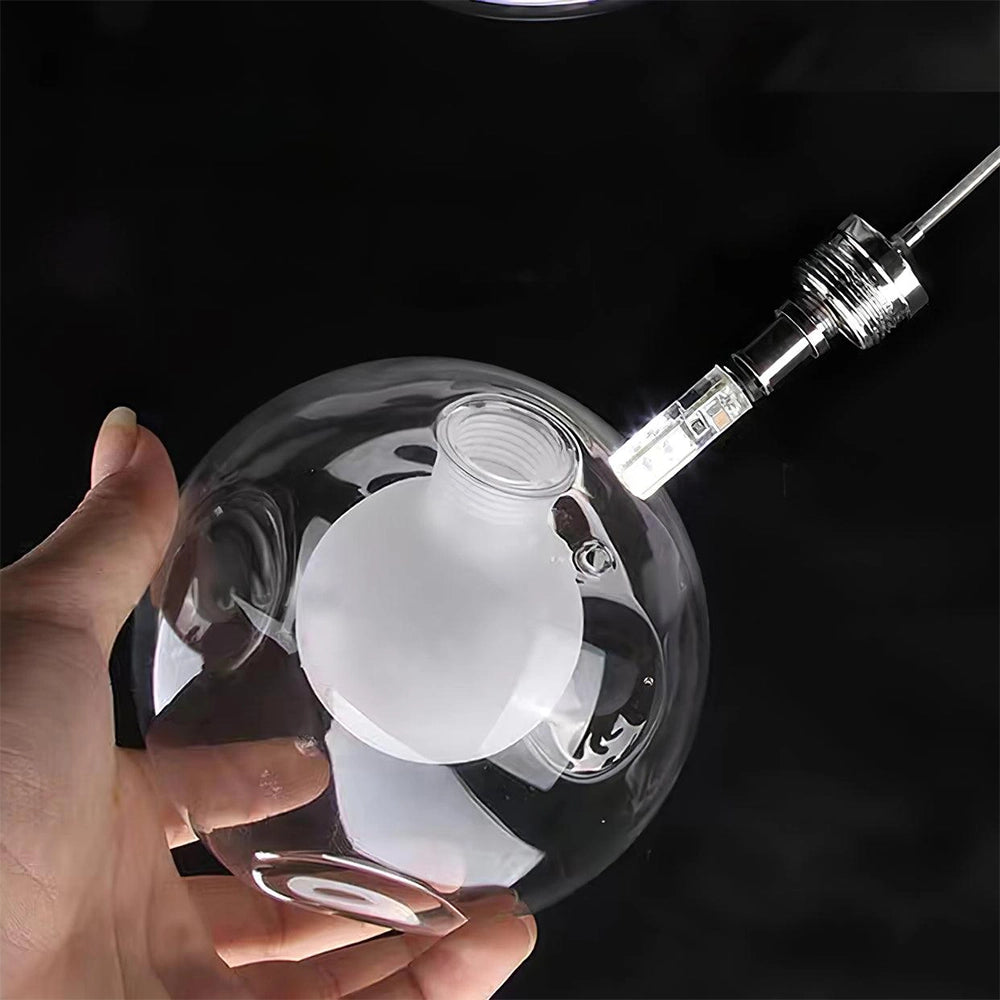 A modern globe pendant chandelier with an adjustable LED ceiling fixture, featuring a sleek circular design that resembles automotive lighting elements.