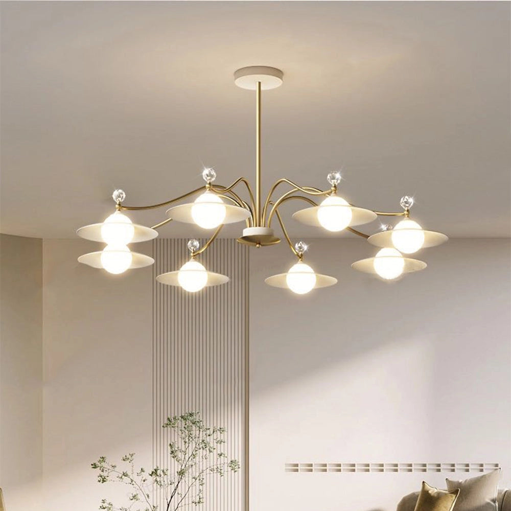 Modern gold chandelier with eight white glass globes and a brass finish, elegantly hanging in a stylishly designed interior space with subtle lighting.