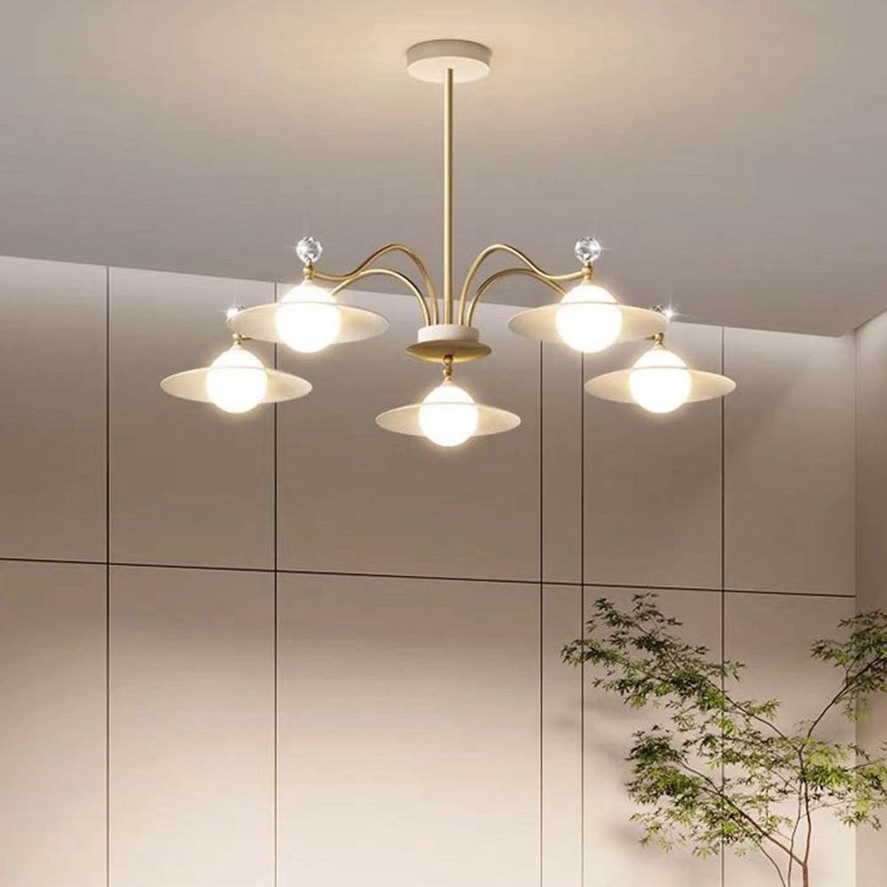 Modern gold chandelier with eight white glass globe lights and a brass finish, featuring a 37.4-inch width, suspended from the ceiling.