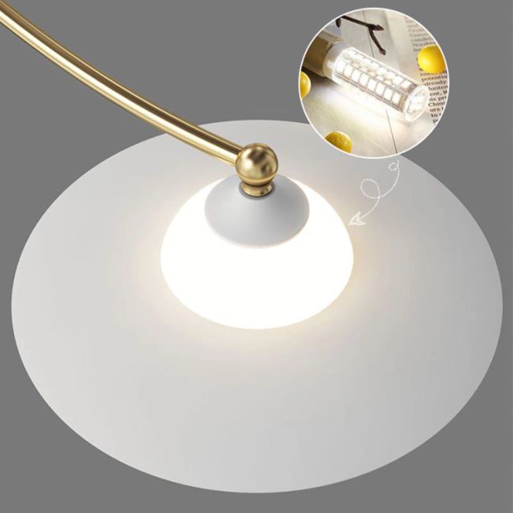 Modern gold chandelier with eight white glass globe lights and a brass finish, designed as a ceiling fixture with a circular arrangement.
