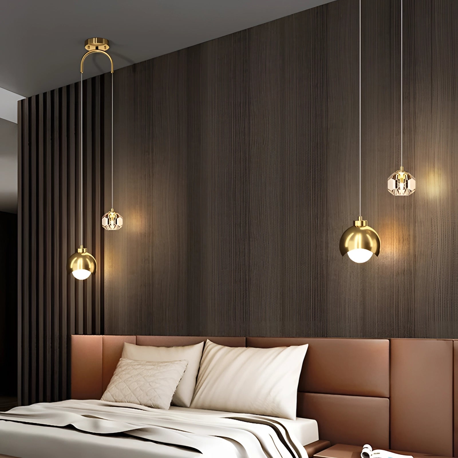 Modern gold dual pendant light hanging from the ceiling, featuring adjustable lengths, in a stylish interior setting with wooden flooring and warm-toned decor elements.