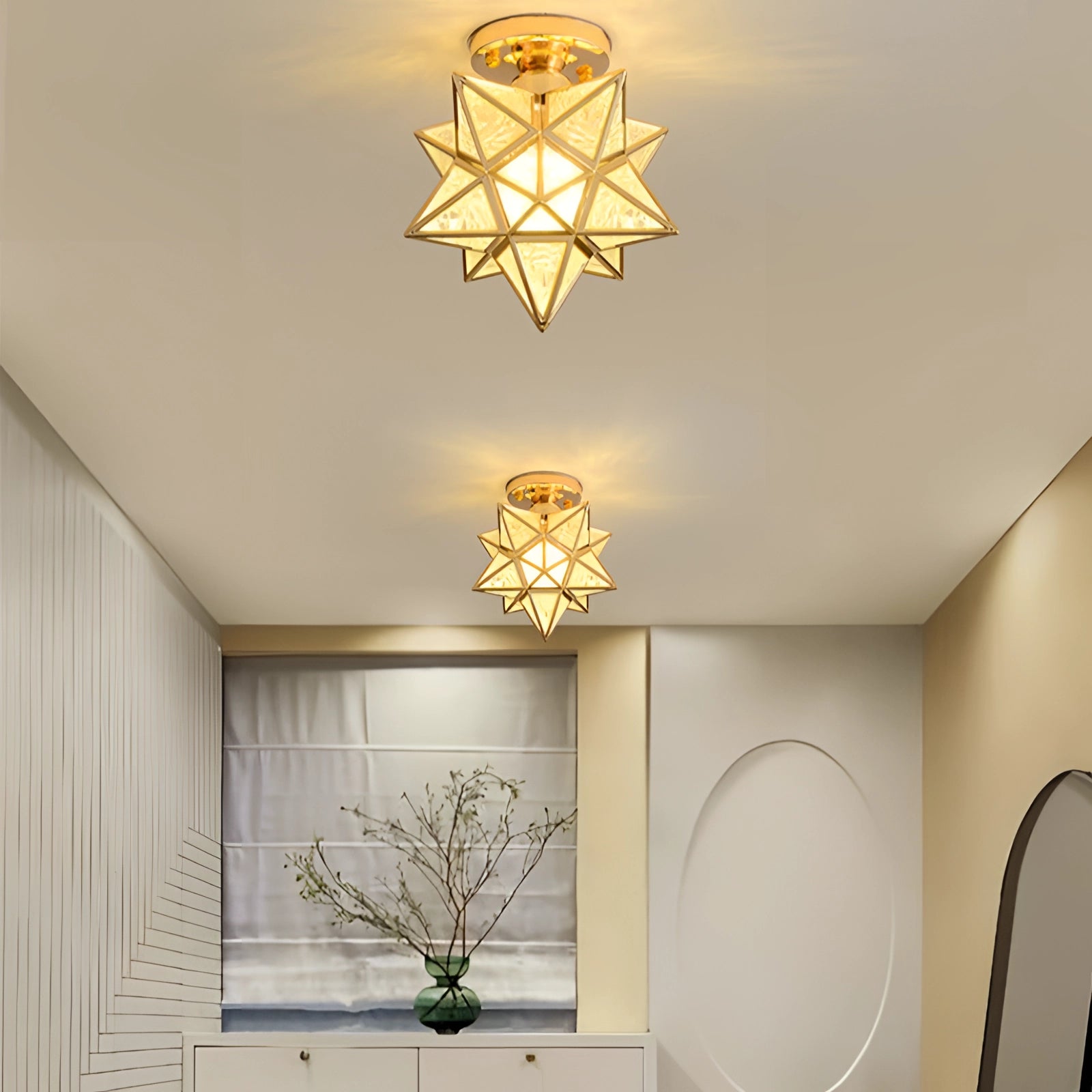Modern gold geometric star ceiling light with a luxury pendant design, featuring a gold finish and frosting details, illuminating a stylish interior space with contemporary and elegant architecture.