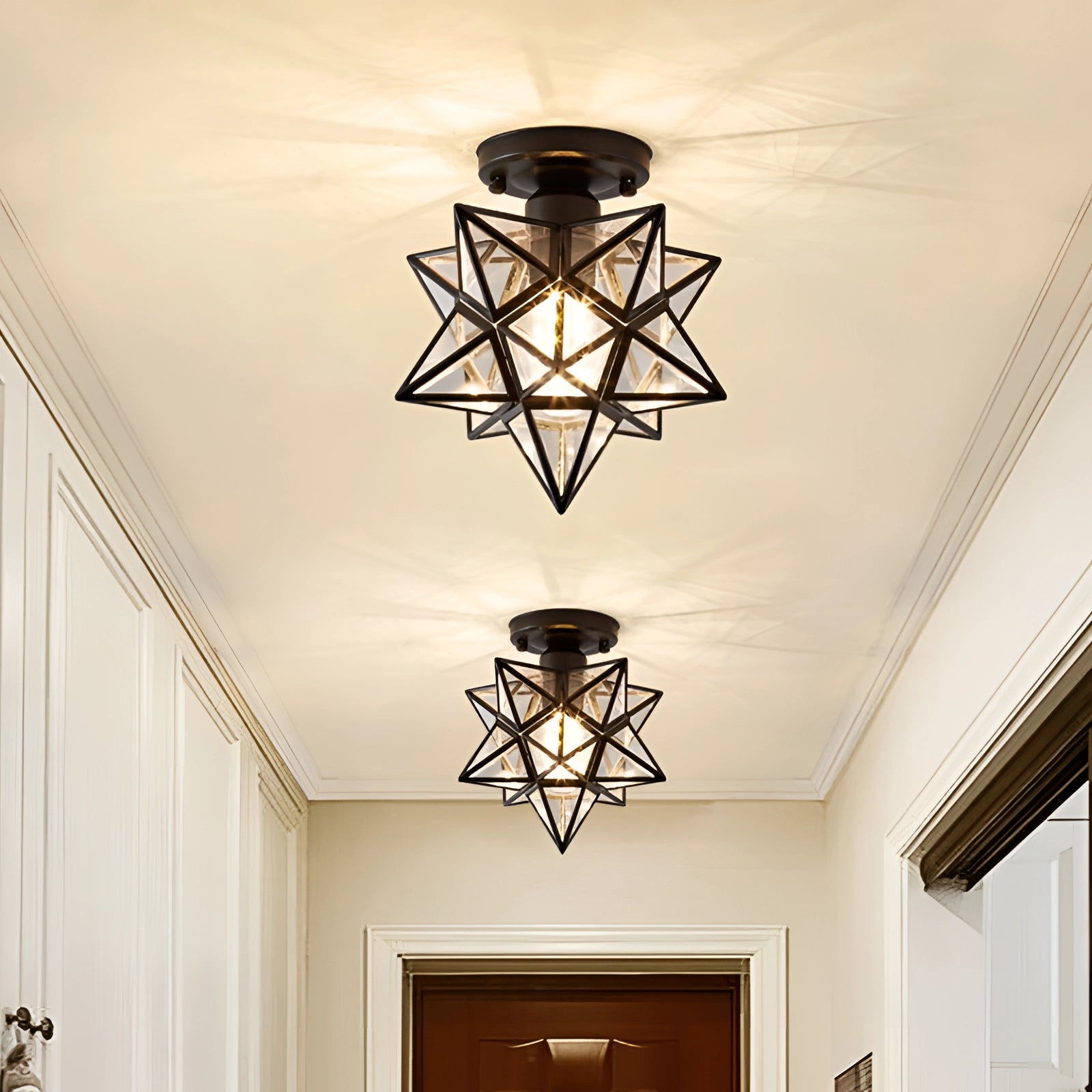 Modern gold geometric star ceiling light hanging from a ceiling, showcasing luxury pendant lamp design in an interior setting.