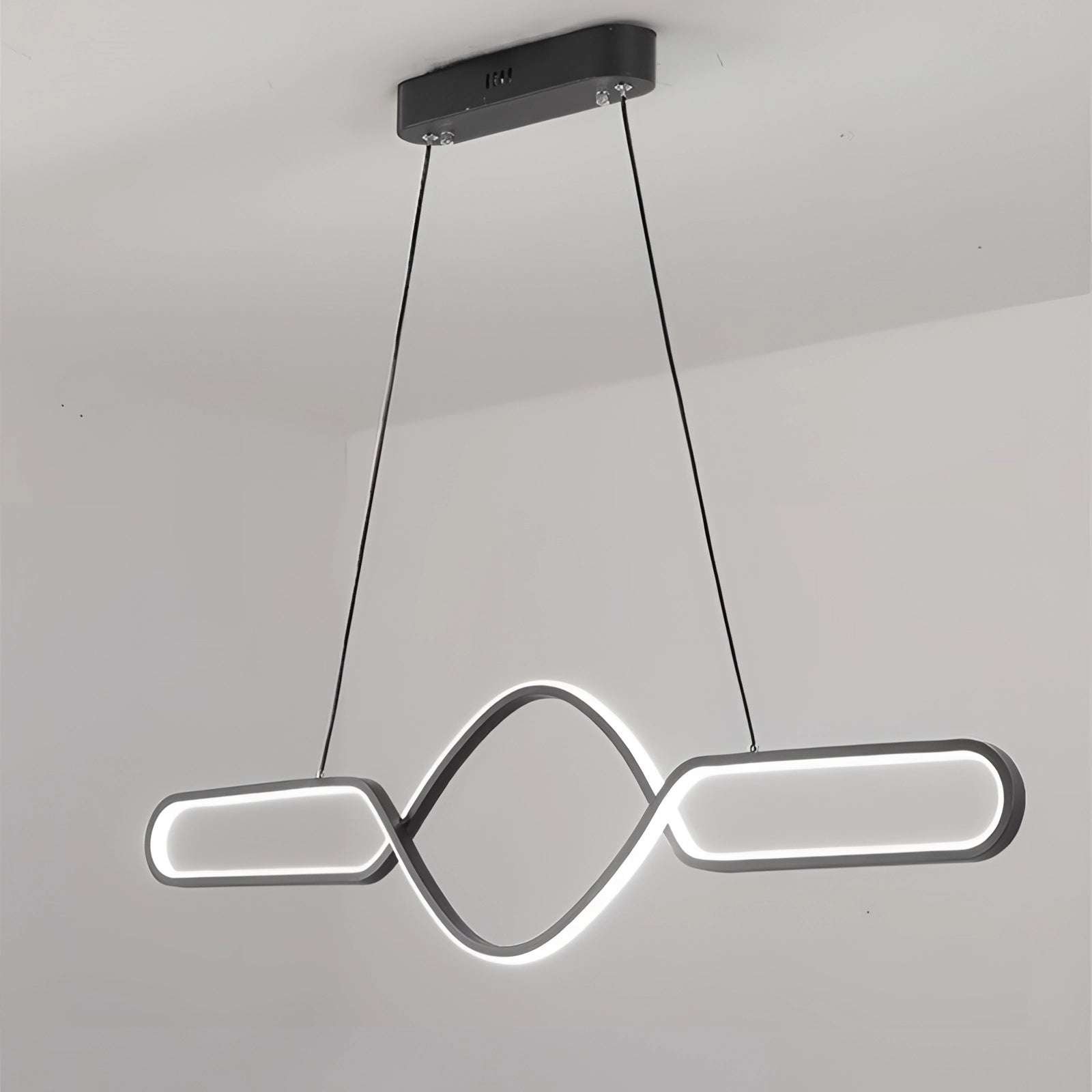 Modern gold LED pendant light with a luxury adjustable infinity design, featuring a sleek and contemporary look with smooth curves and a polished finish.