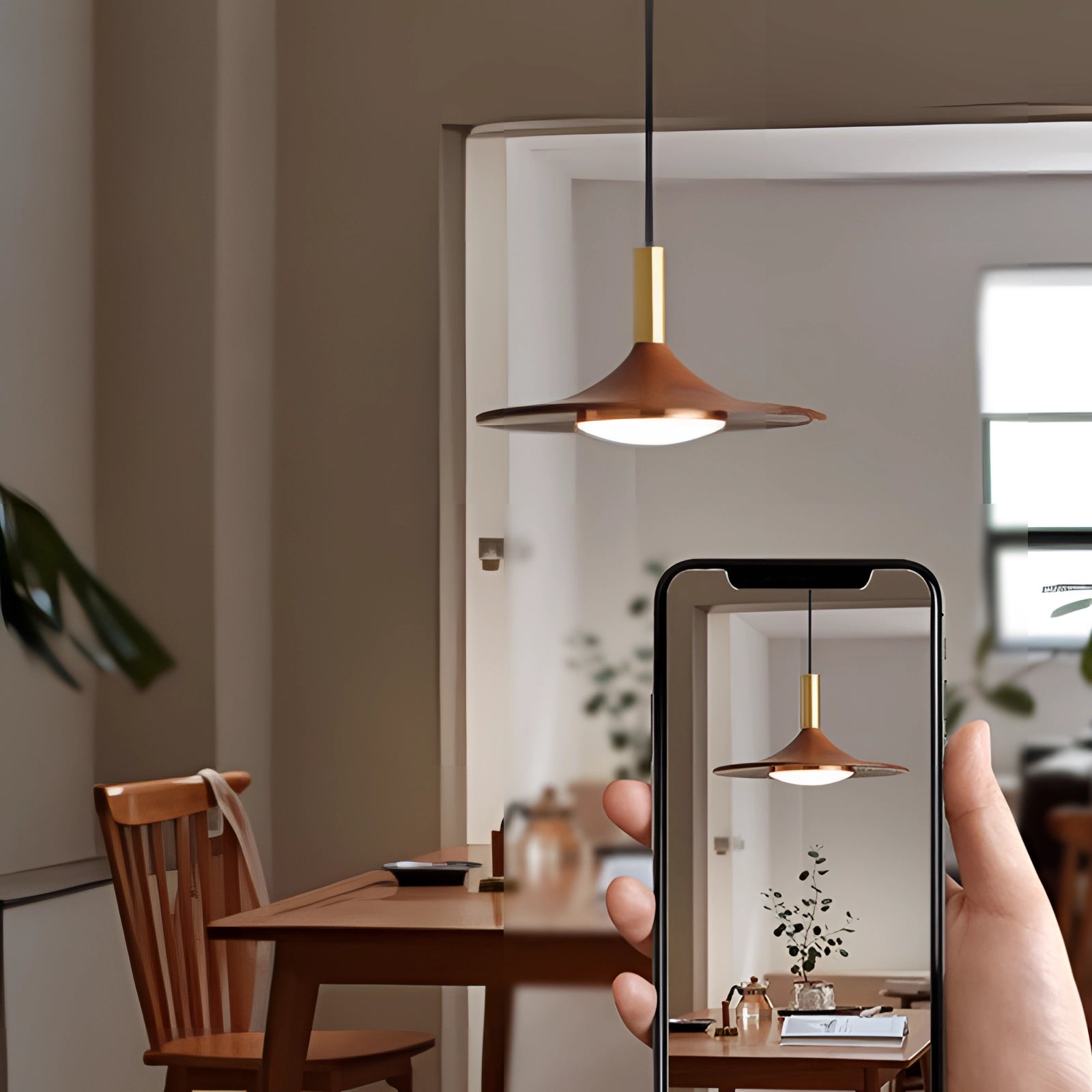 Modern gold LED pendant light with a Scandinavian design, elegantly hanging in a stylish interior setting featuring wooden furniture, green plants, and a comfortable ambiance.