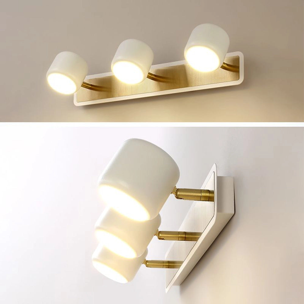 Modern Gold LED Vanity Light with a minimalist design, featuring a white finish and three lights. The fixture is rectangular with metal elements, suitable for bathroom installations.