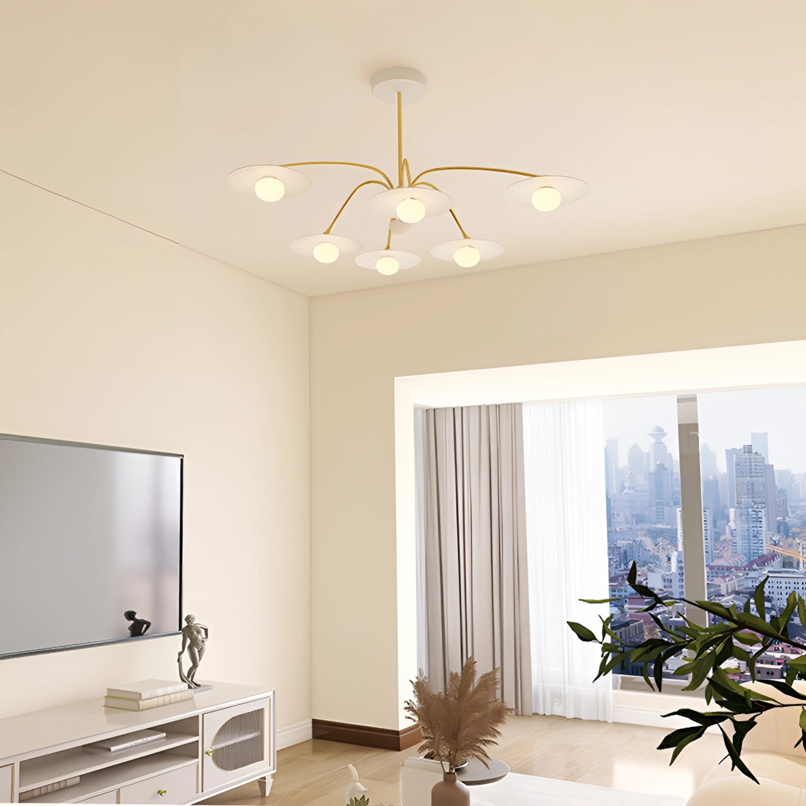 Modern gold opal glass mid-century chandelier elegantly hanging in a stylishly decorated interior space with white walls, houseplants, and wooden accents, enhancing the room's lighting.