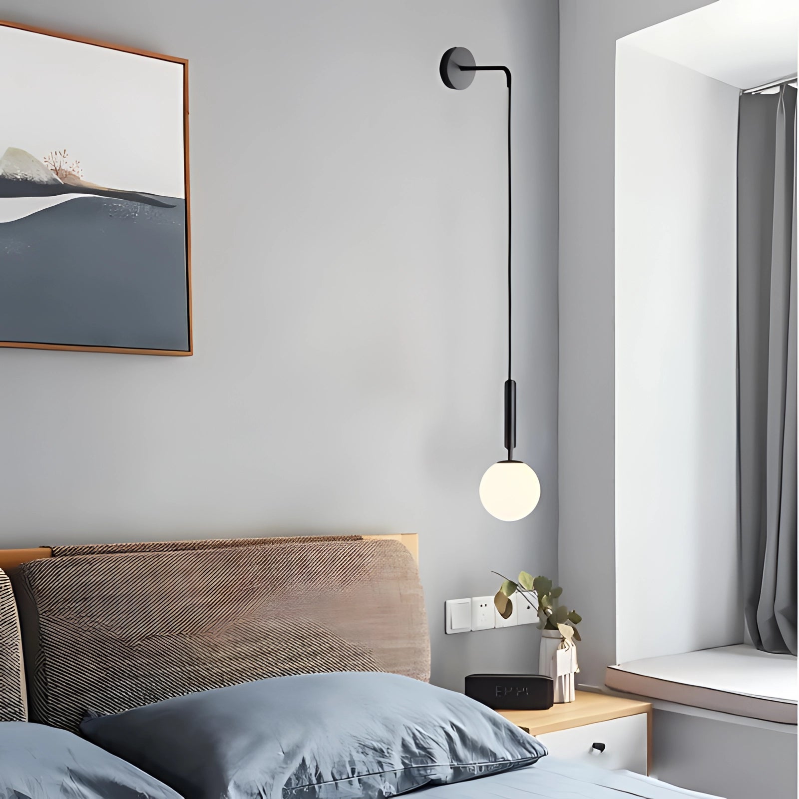 Modern gold wall lamp with adjustable LED sconce, brass finish, featuring a sleek design and a grey shade, mounted on a wooden panel.