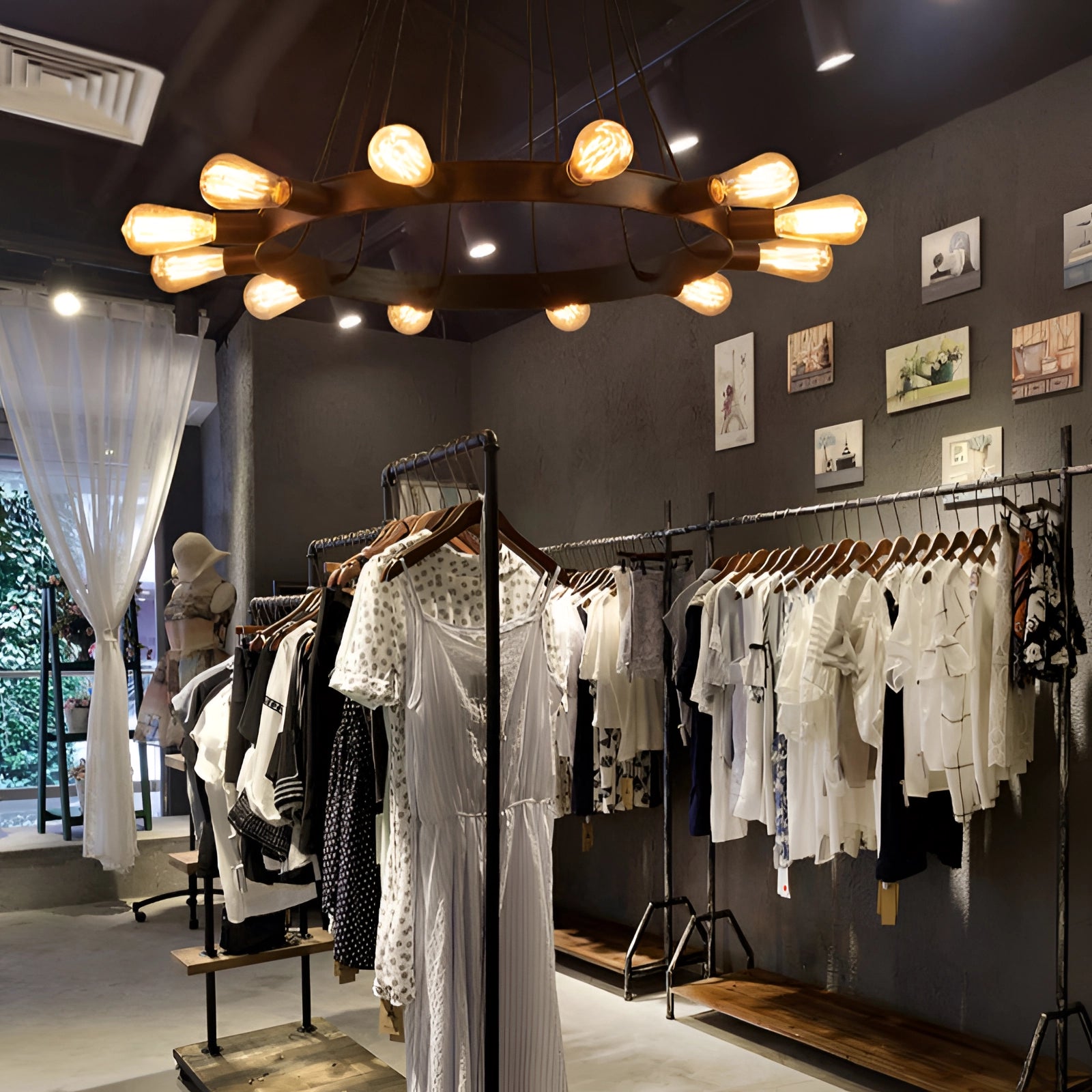 Circular modern industrial LED chandelier hanging from a ceiling, featuring a sleek and contemporary design suitable for interior spaces.