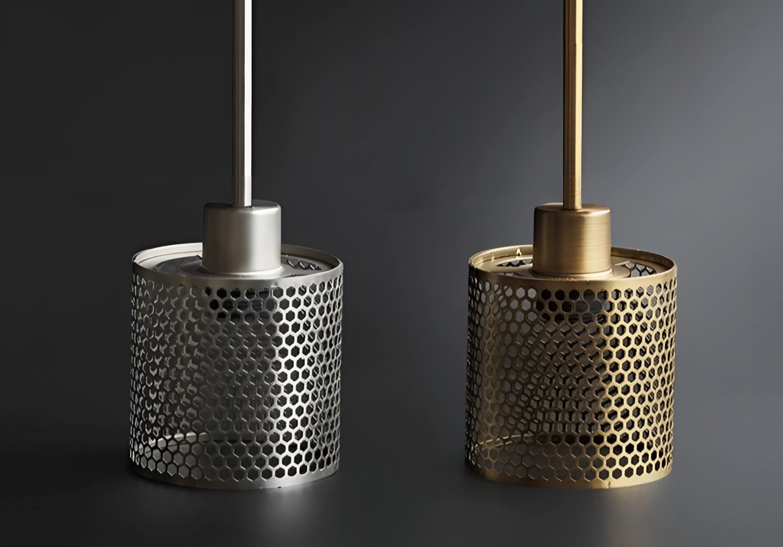 Modern industrial wall-mounted sconce featuring a rectangular metal base and cylindrical glass light fixture.