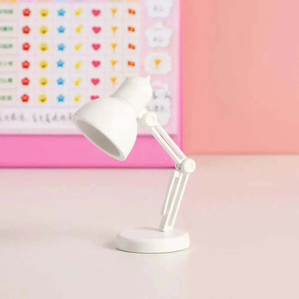 A modern LED desk lamp with an adjustable arm in a sleek black design, featuring a minimalist and compact style.