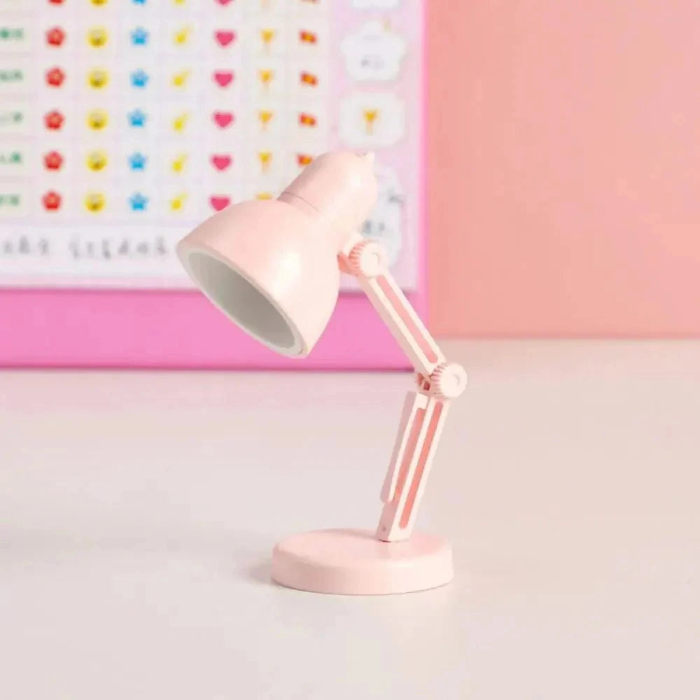 Pink modern LED desk lamp with an adjustable arm, featuring a minimalist and compact design.