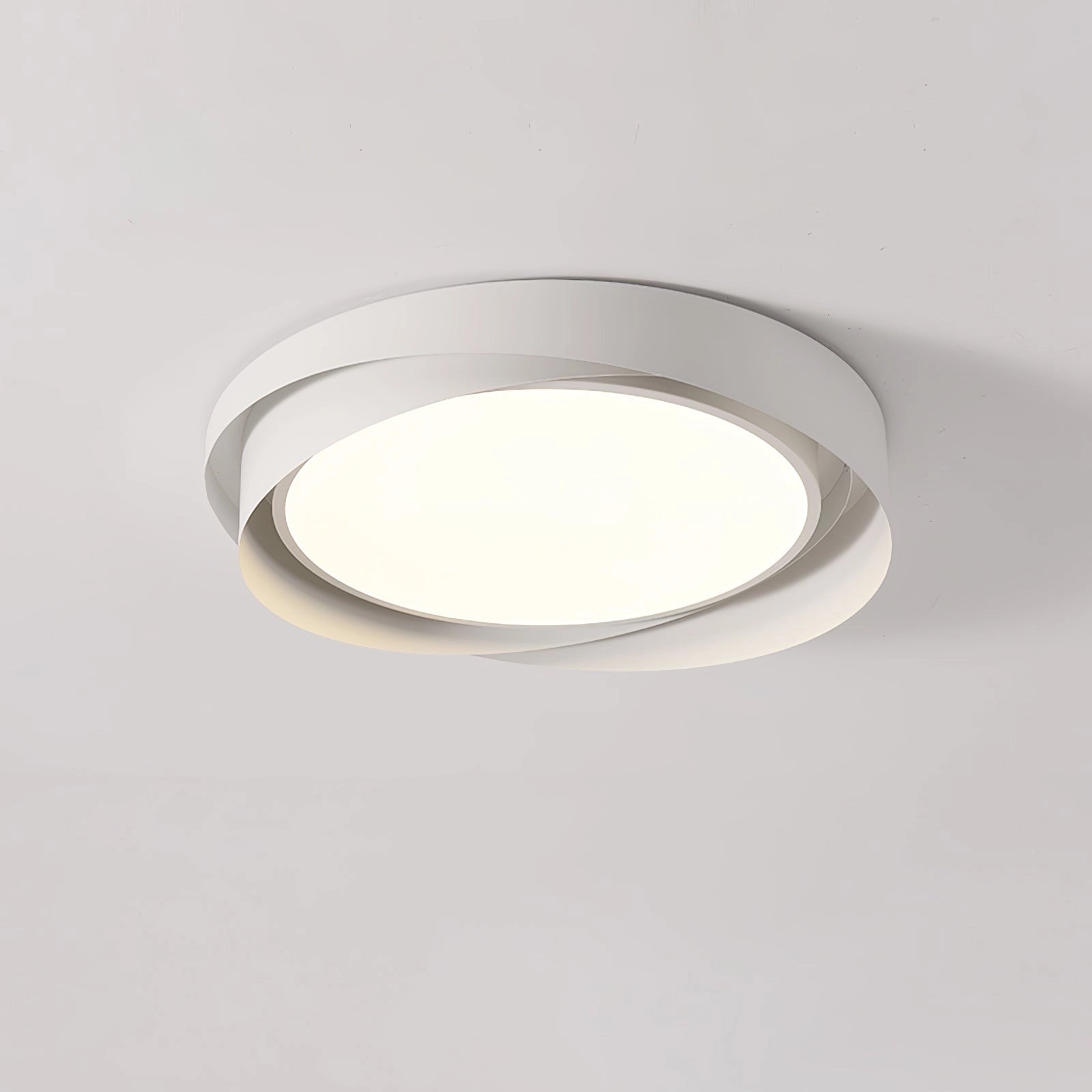 Modern LED ceiling lamp with a contemporary circular flush mount design, measuring 18.1 inches in diameter and 2.8 inches in height, featuring a white finish and cool light output, installed on a ceiling.