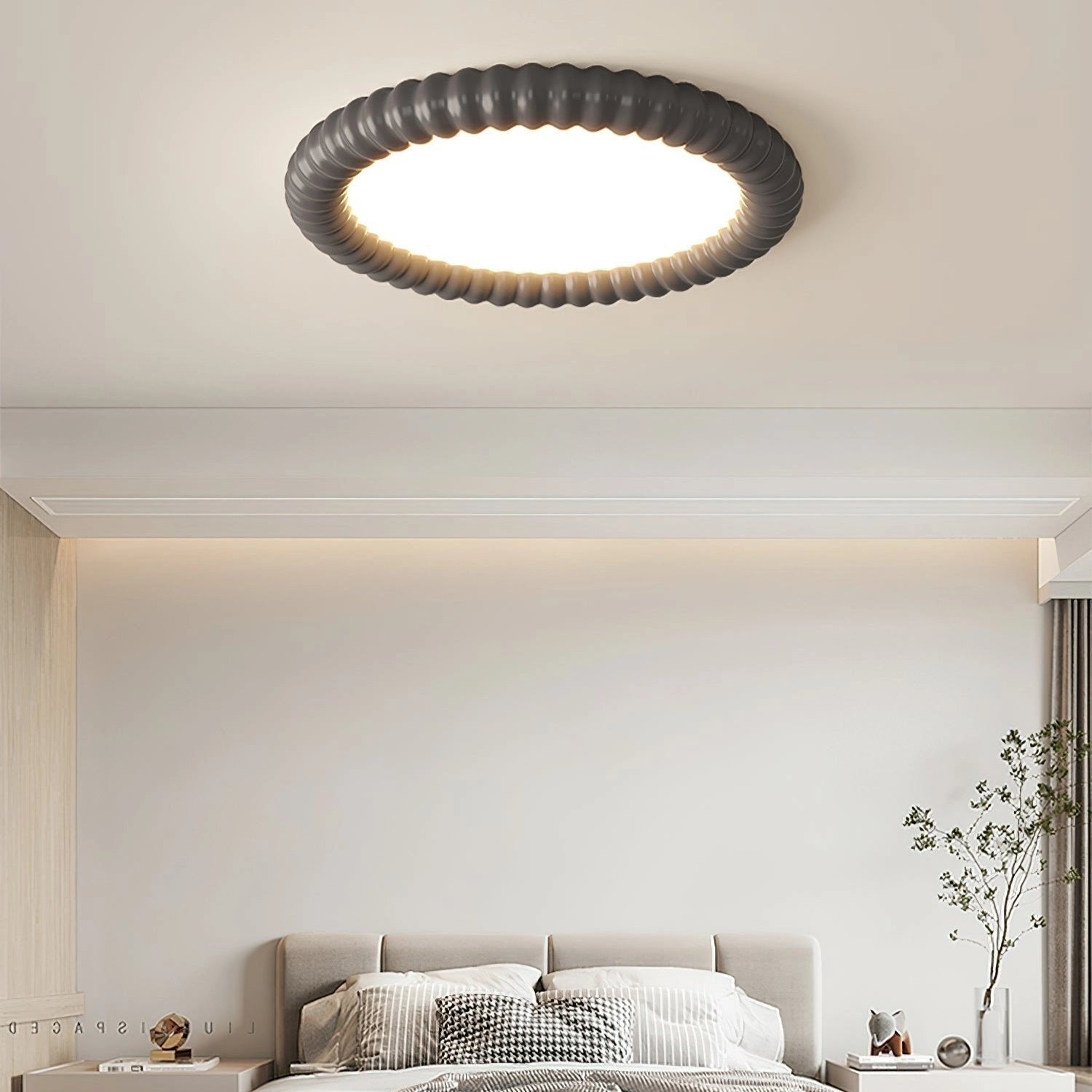 Modern LED ceiling light with a dimmable feature, installed in a cozy living room with brown and white furniture, including a comfortable couch and wooden accents.