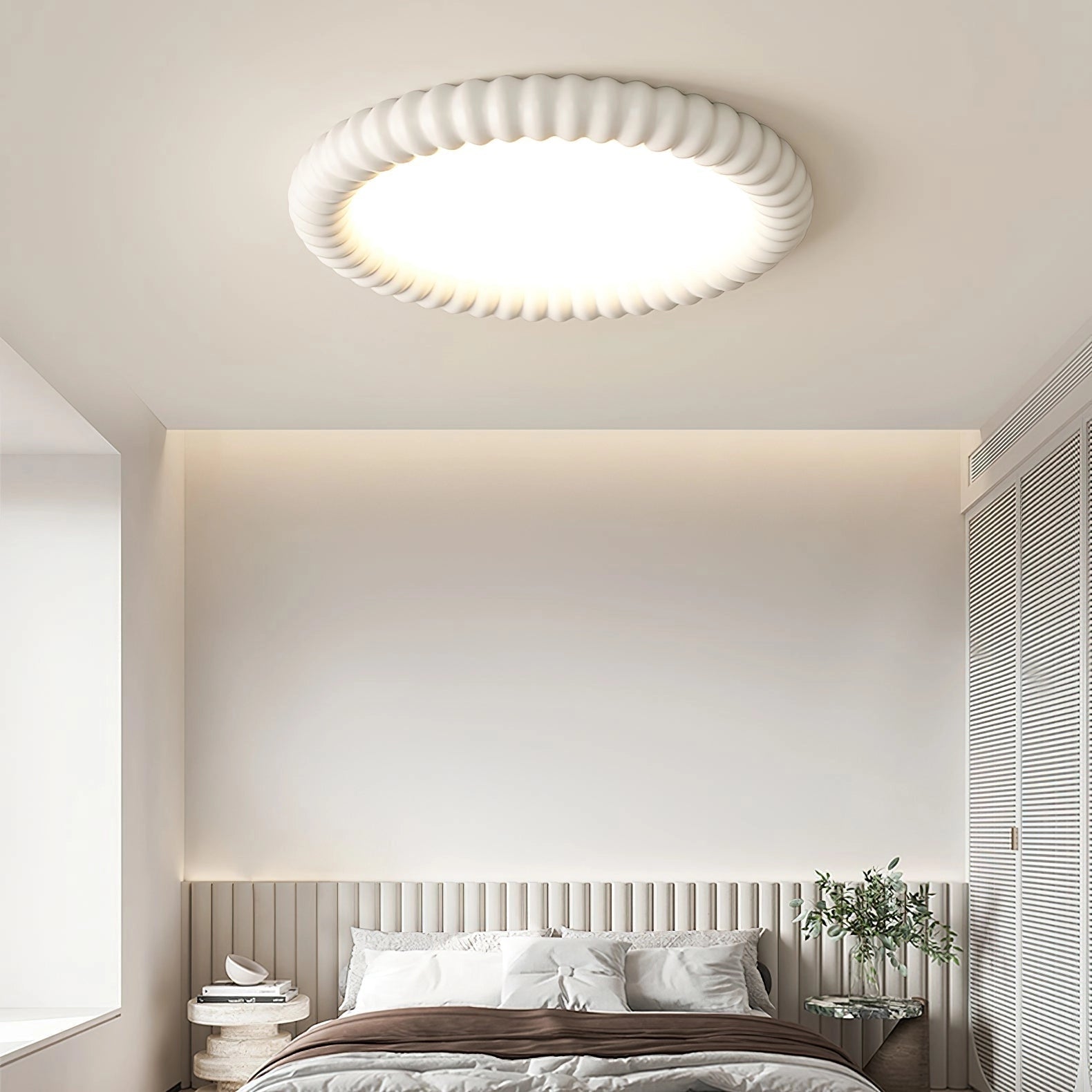 Modern LED ceiling light installed in a contemporary white room with large windows and wooden accents, showcasing its dimmable and energy-efficient features.