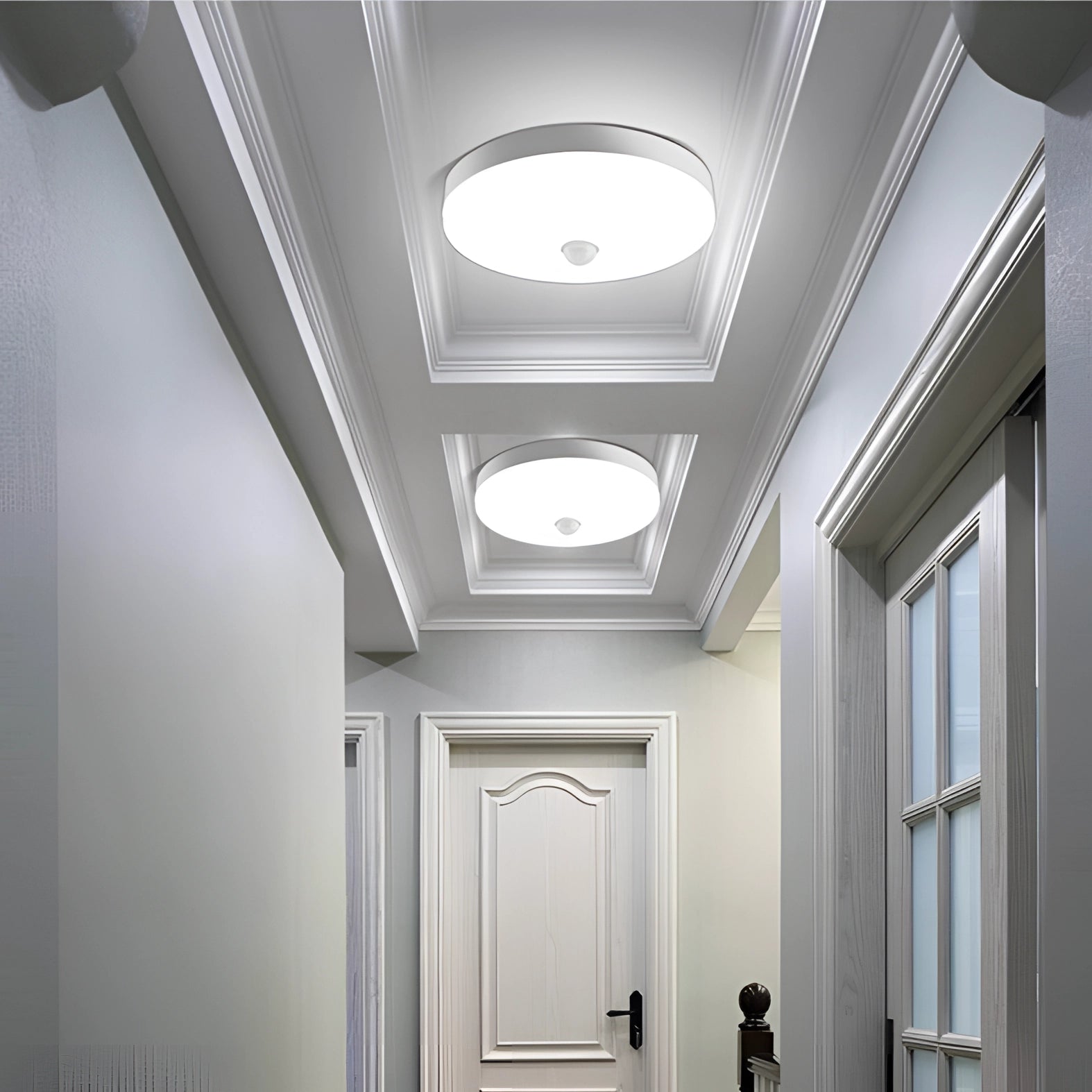 Modern LED ceiling light fixture with a sleek, minimalist design, illuminating a stylish interior space with wooden elements and symmetrical lines.