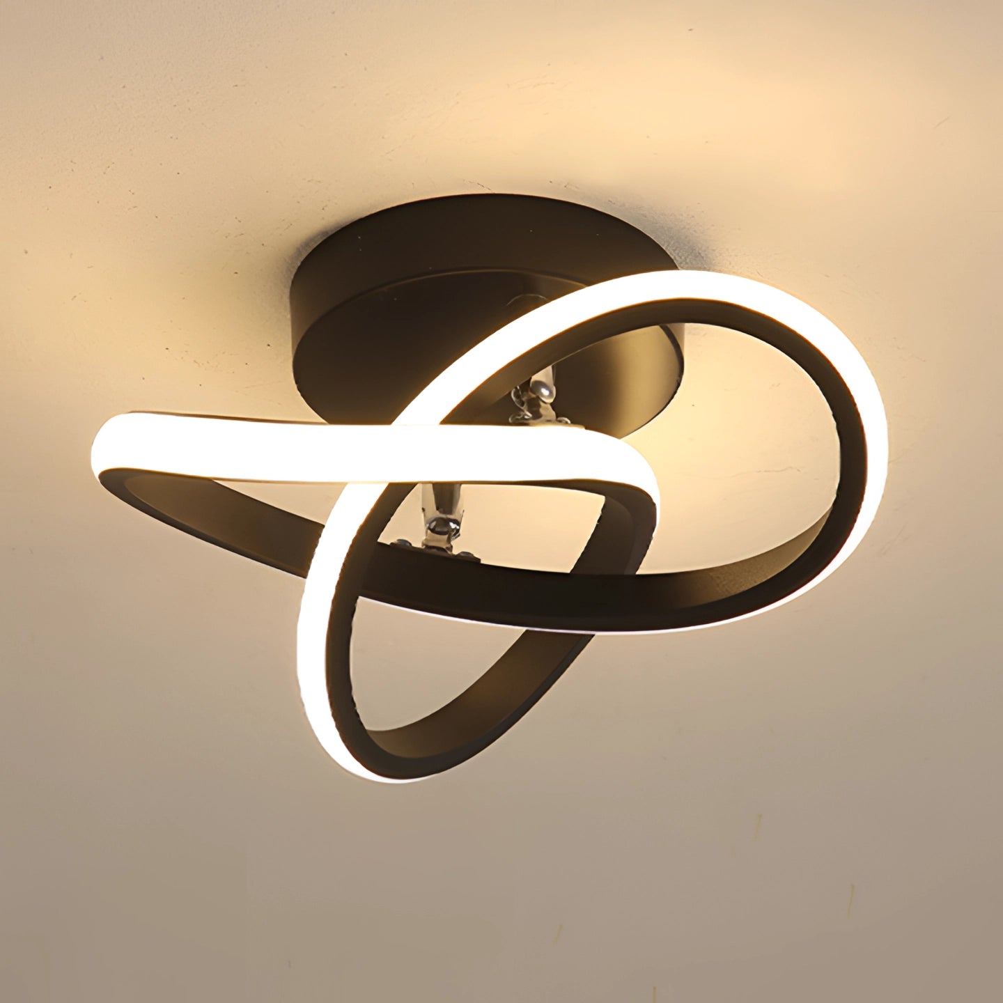 Modern LED ceiling light fixture with a sleek, circular metallic design, featuring elegant tints and shades, resembling a luxury fashion accessory.