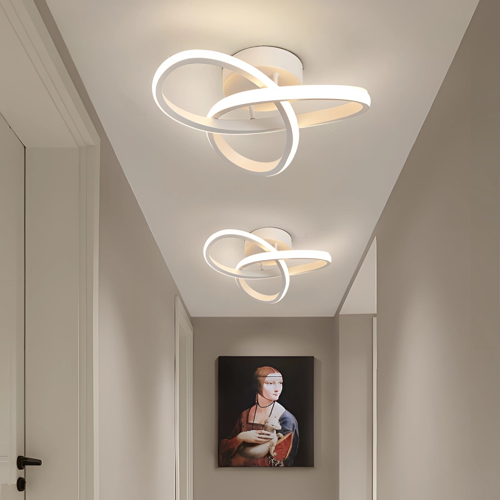Modern LED ceiling light fixture in an elegantly designed home interior with wooden accents, picture frames, and large windows.