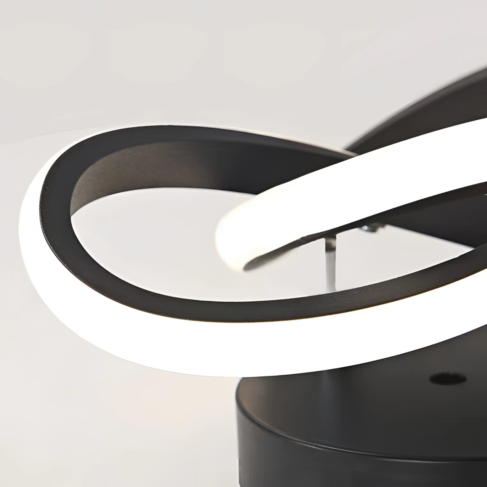 Modern LED ceiling light fixture with a sleek circular design, featuring metal accents and a minimalist, luxury aesthetic for elegant home interiors.