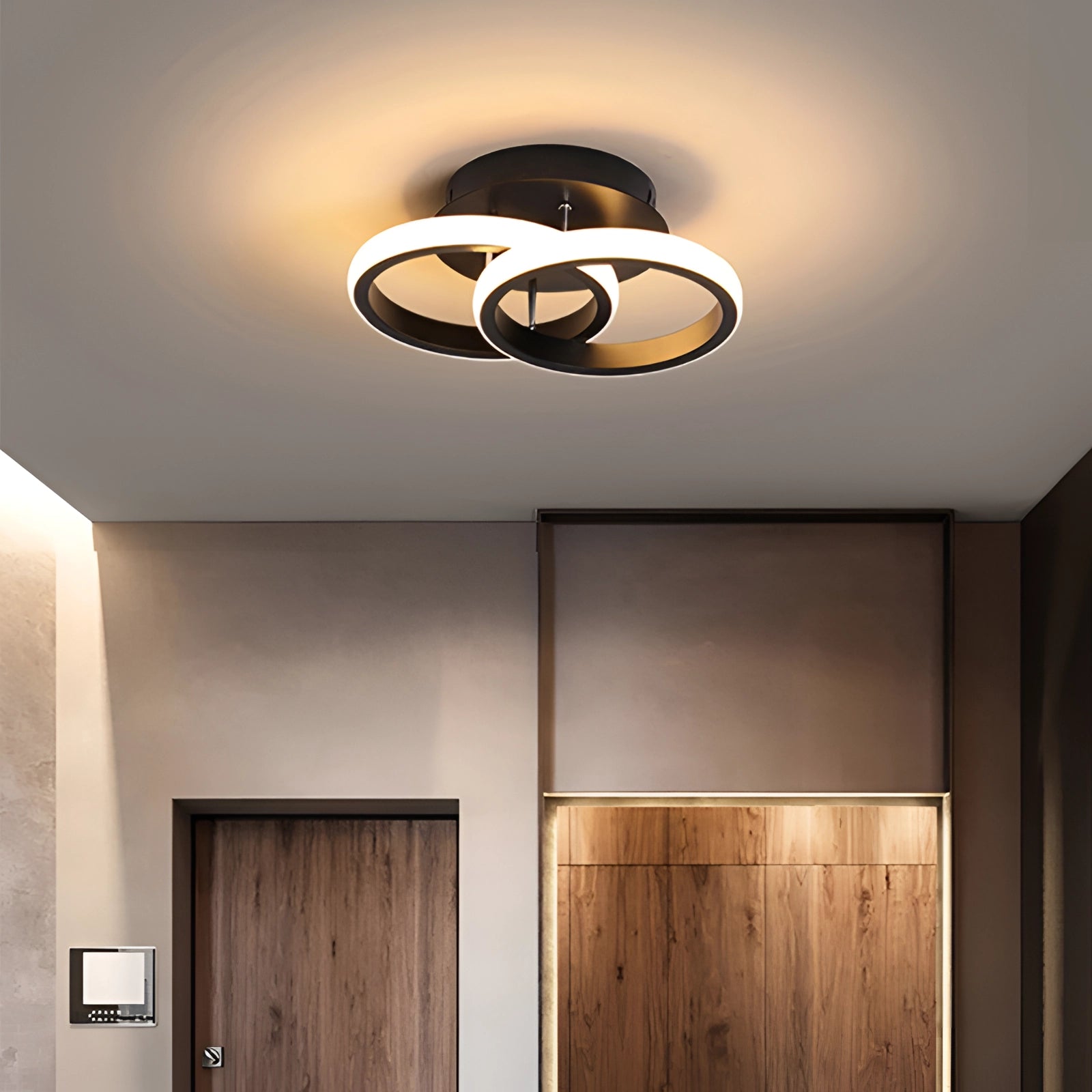 Modern LED ceiling light with a wooden fixture, emitting an amber glow, enhancing the elegant interior design of a home.