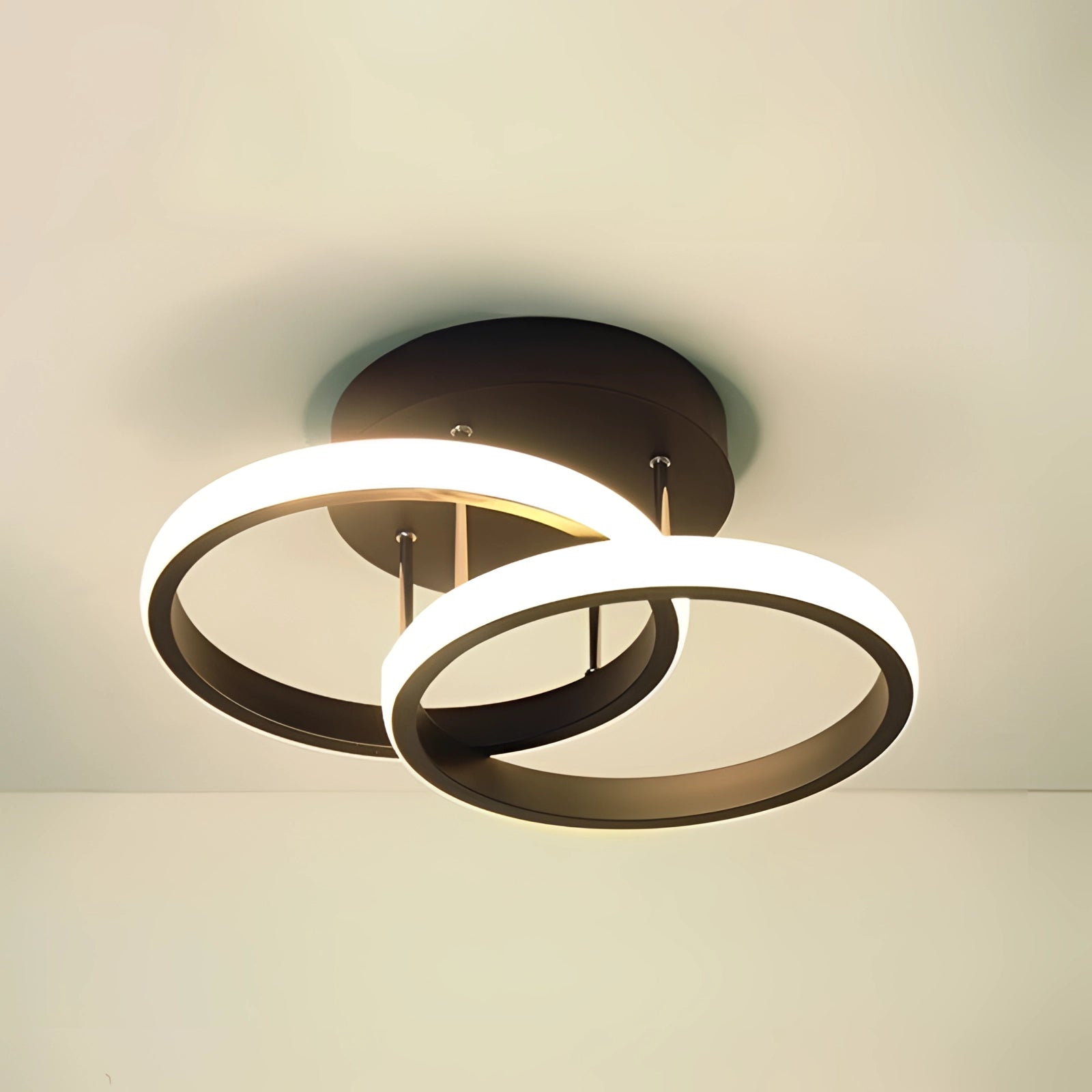 Modern LED ceiling light fixture in black circular design with gold and amber accents, suitable for luxury and elegant home decor.
