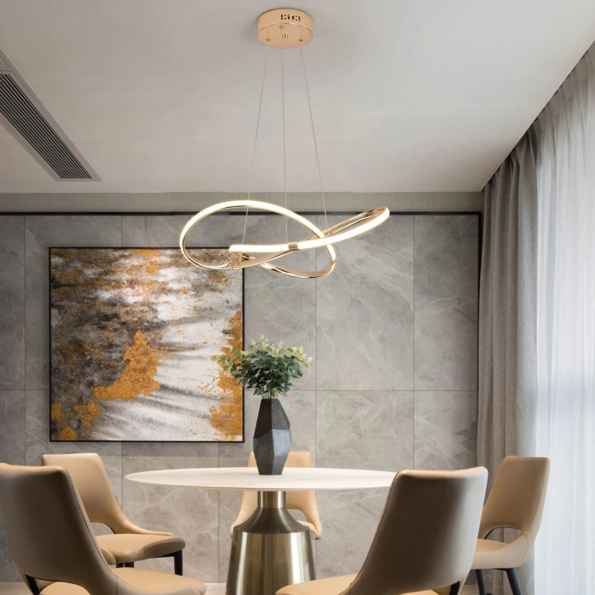 Modern LED chandelier with geometric design and gold finish, hanging in a stylish interior setting with contemporary furniture and floor decor.