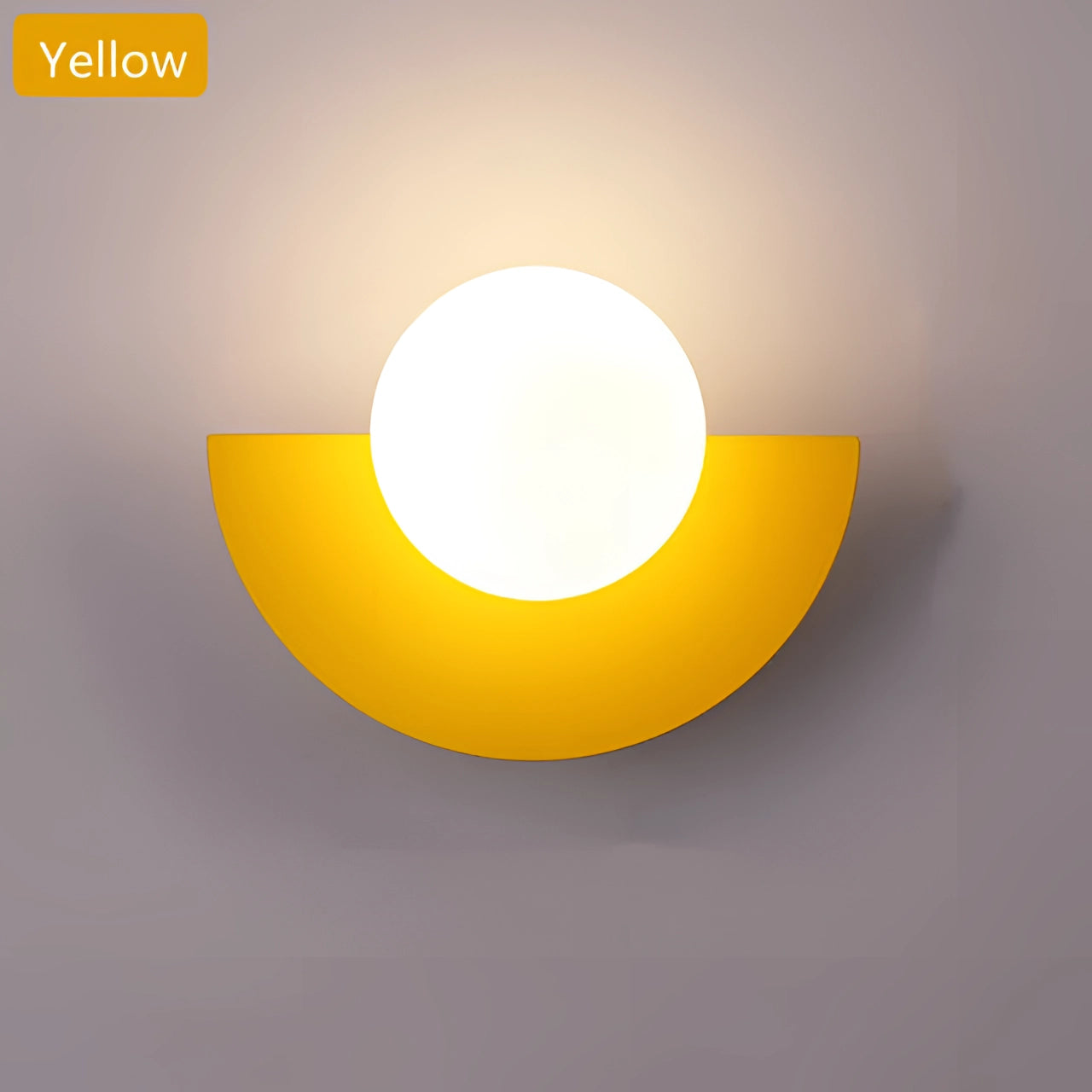 Modern LED half-moon wall light with a minimalist design, featuring a yellow finish and three-color lighting options, mounted on a wall in a living room setting.