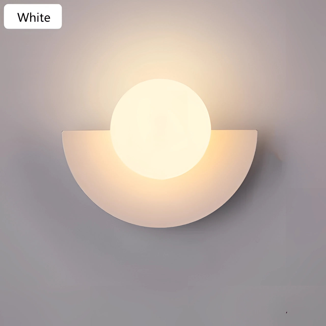 Modern LED Half-Moon Wall Light in white, featuring a minimalist design with a three-color light option, ideal for contemporary living room decor.