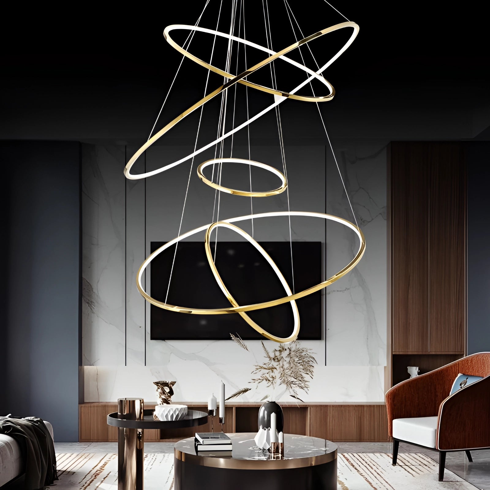 Modern LED Orbital Chandelier with 5 tiers displayed in a contemporary living room setting, featuring a mix of black and white elements, a wooden table with a plant, and a couch, highlighting the interior design and luxury lighting.
