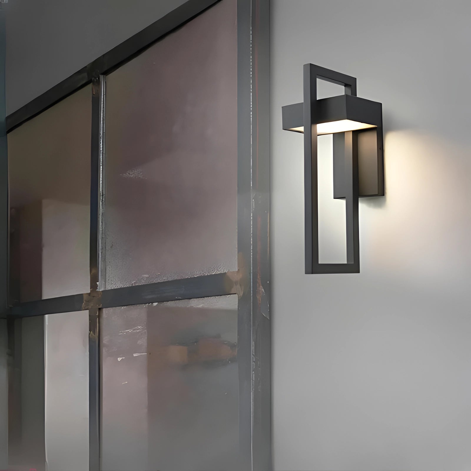 Modern LED outdoor wall light with a sleek rectangular design attached to a wooden wall, showcasing its energy-efficient and weather-resistant features ideal for exterior lighting.